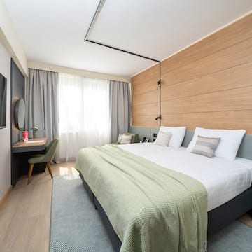 a room with a bed and a desk