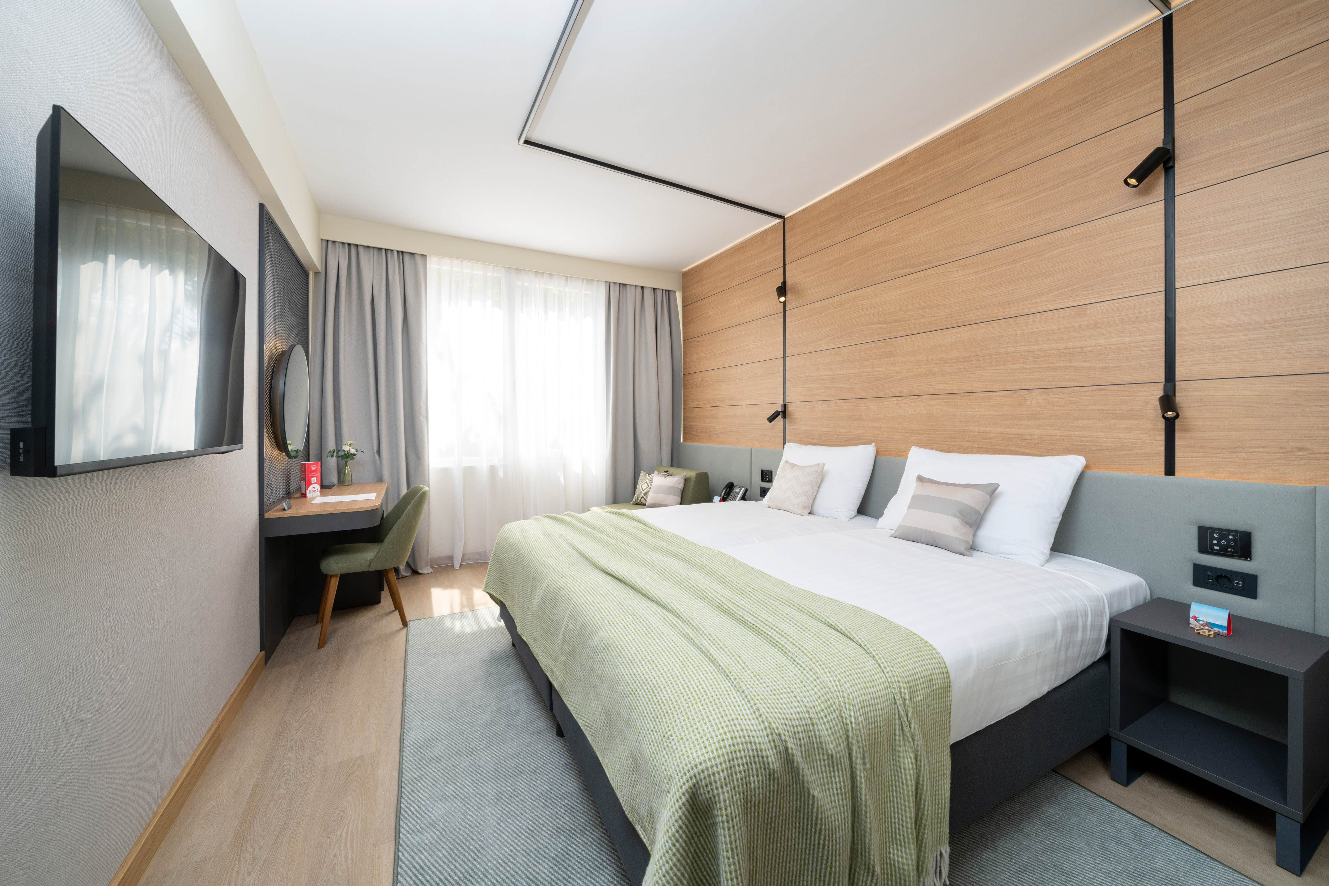 a room with a bed and a desk