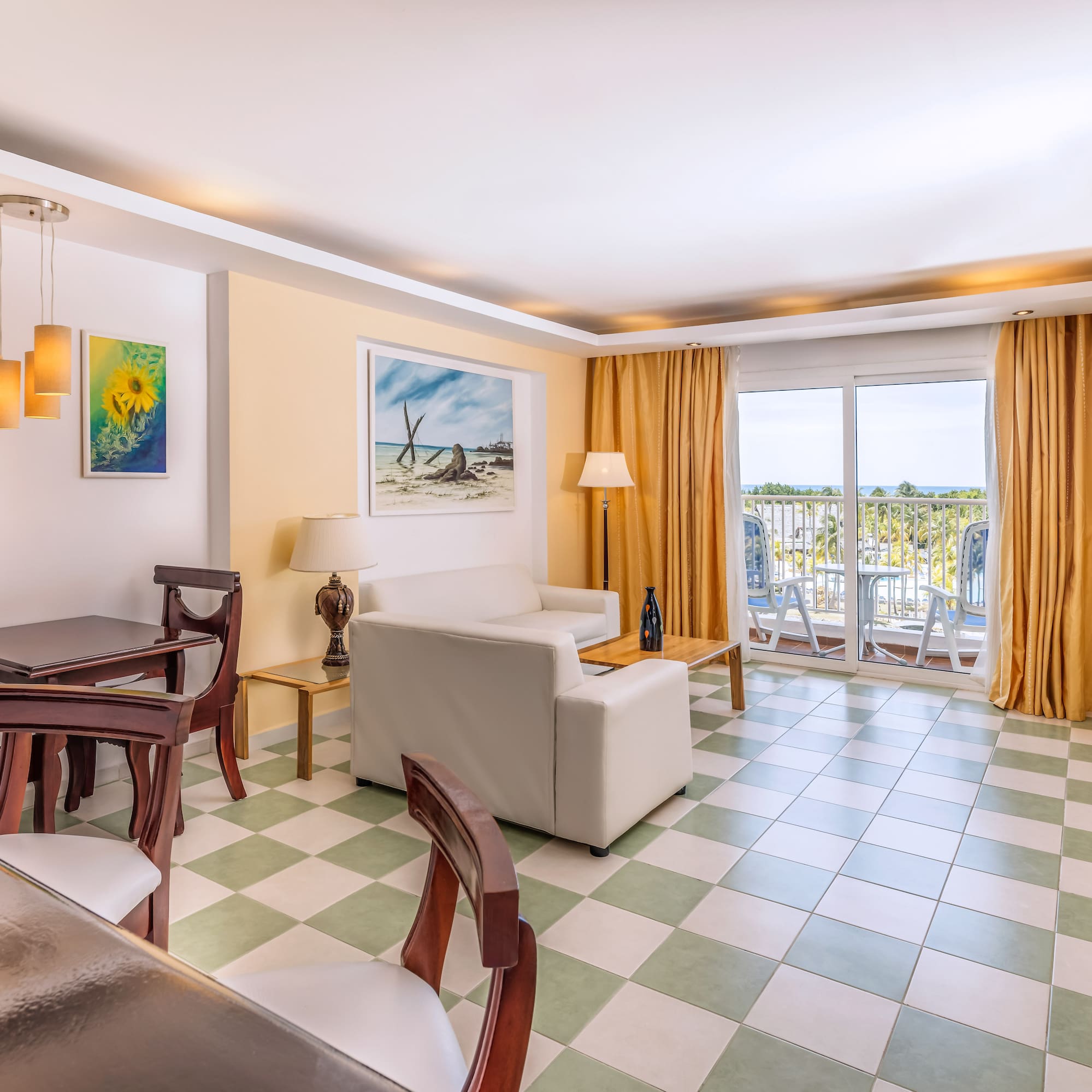 a room with a couch and chairs and a table