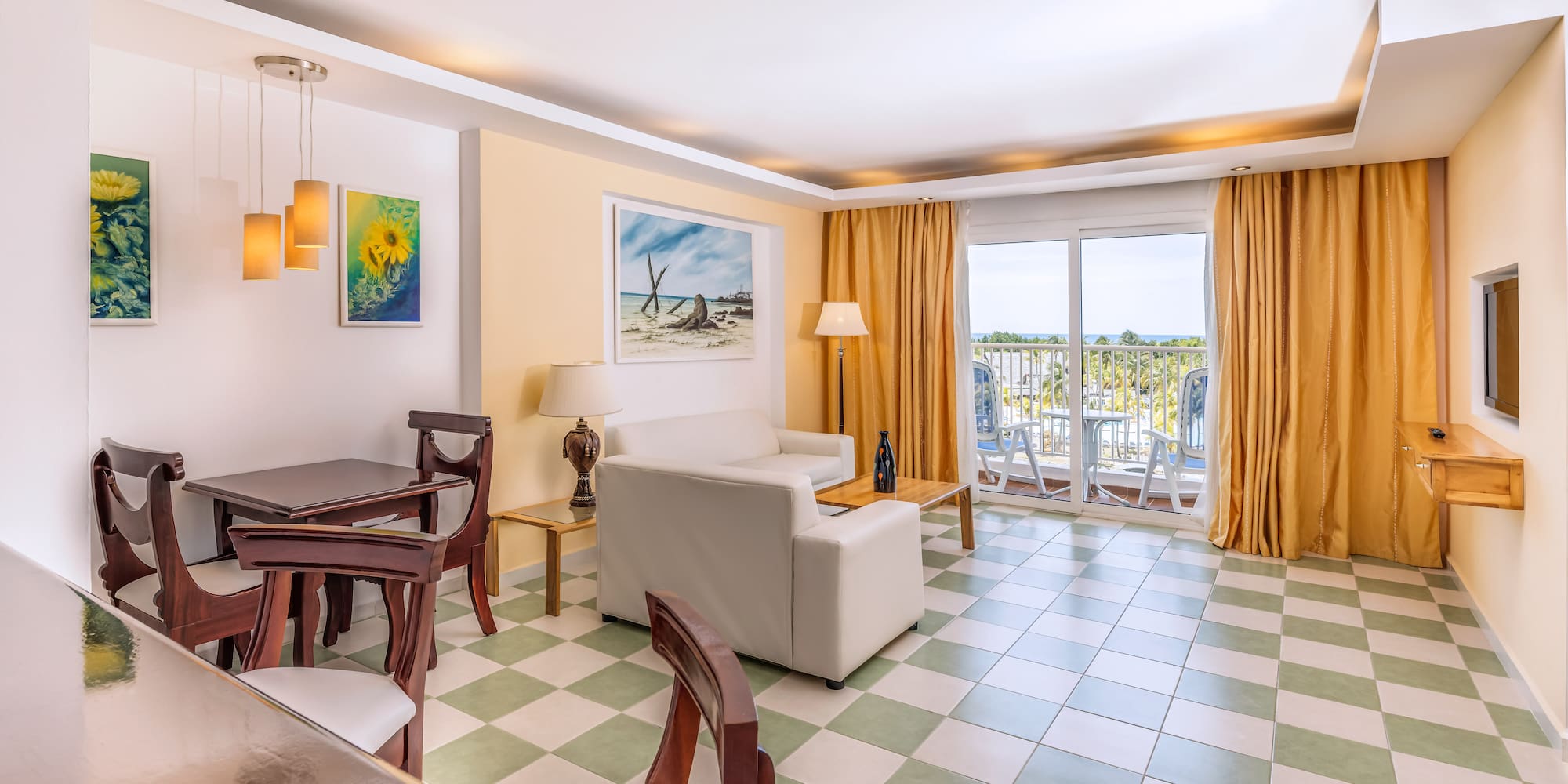 a room with a couch and chairs and a table