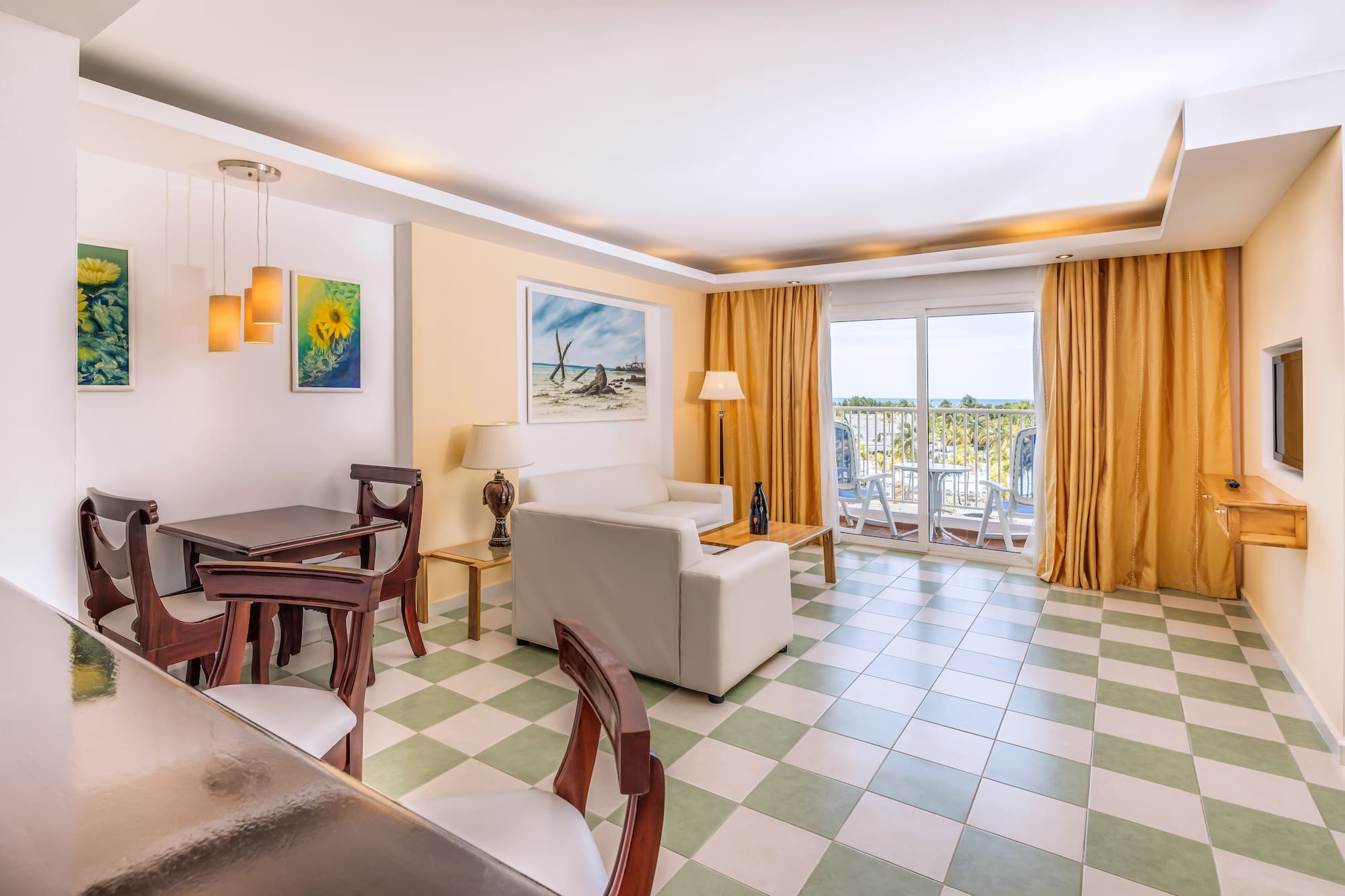 a room with a couch and chairs and a table