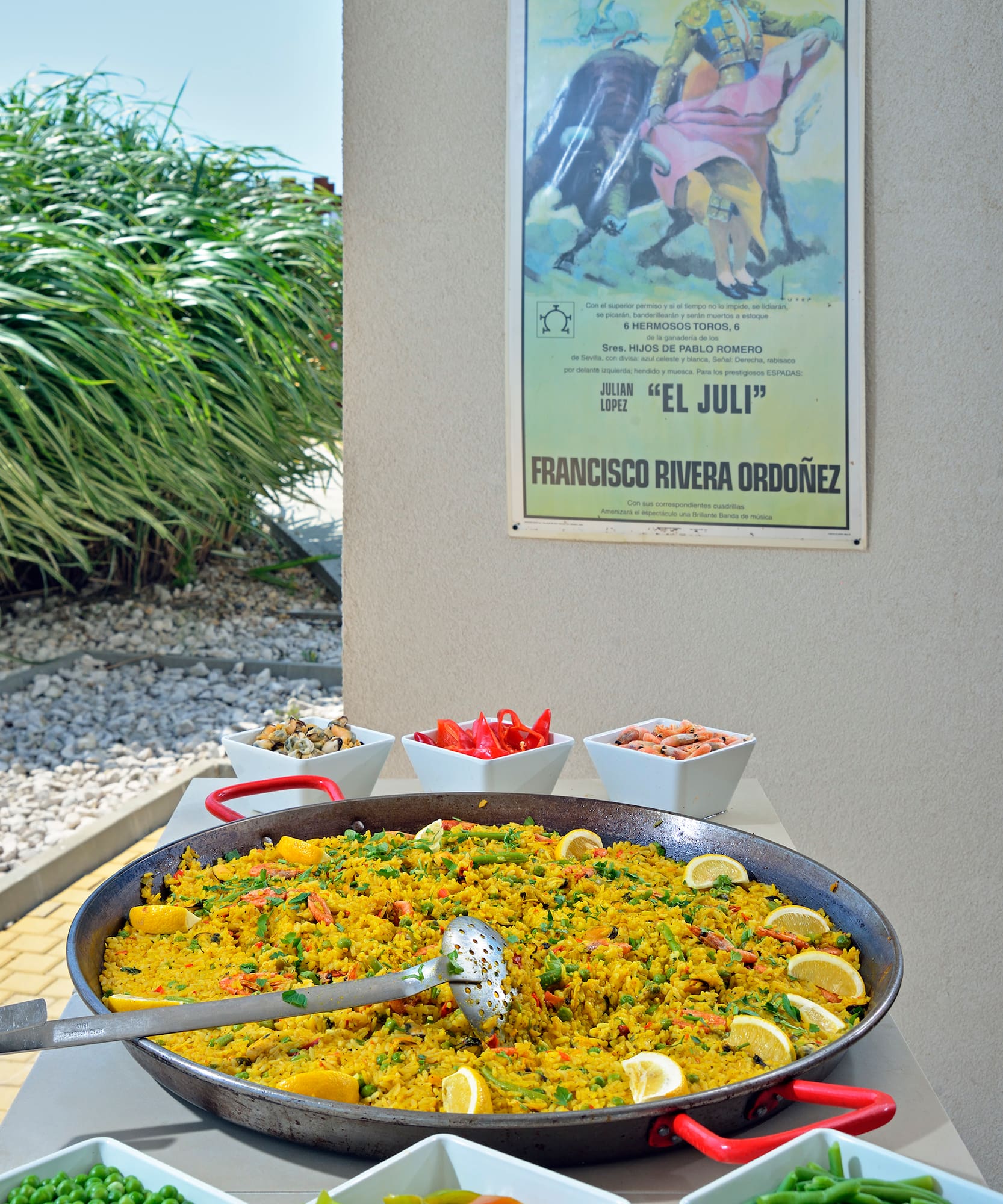 a large pan of food with a poster on the wall