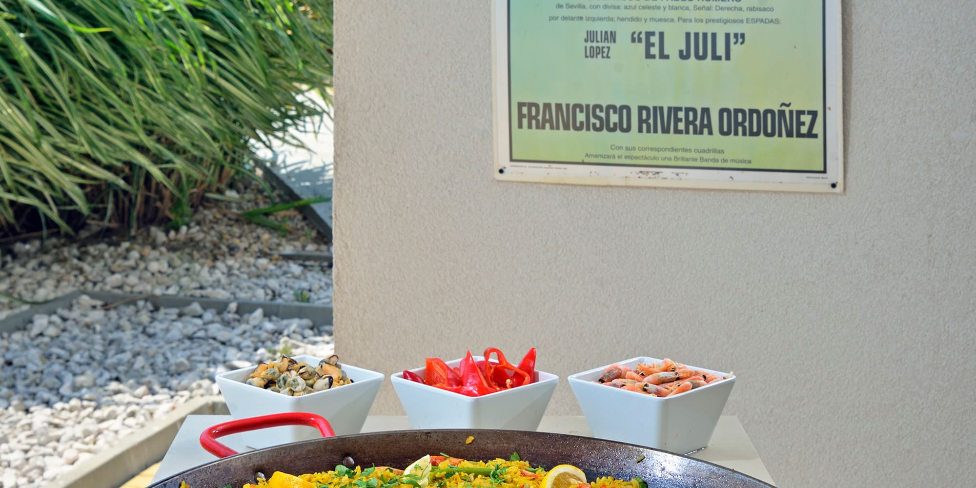 a large pan of food with a poster on the wall
