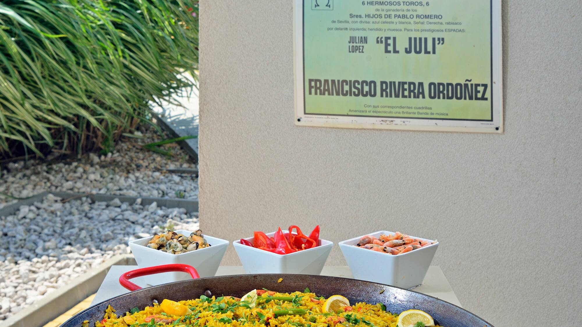 a large pan of food with a poster on the wall