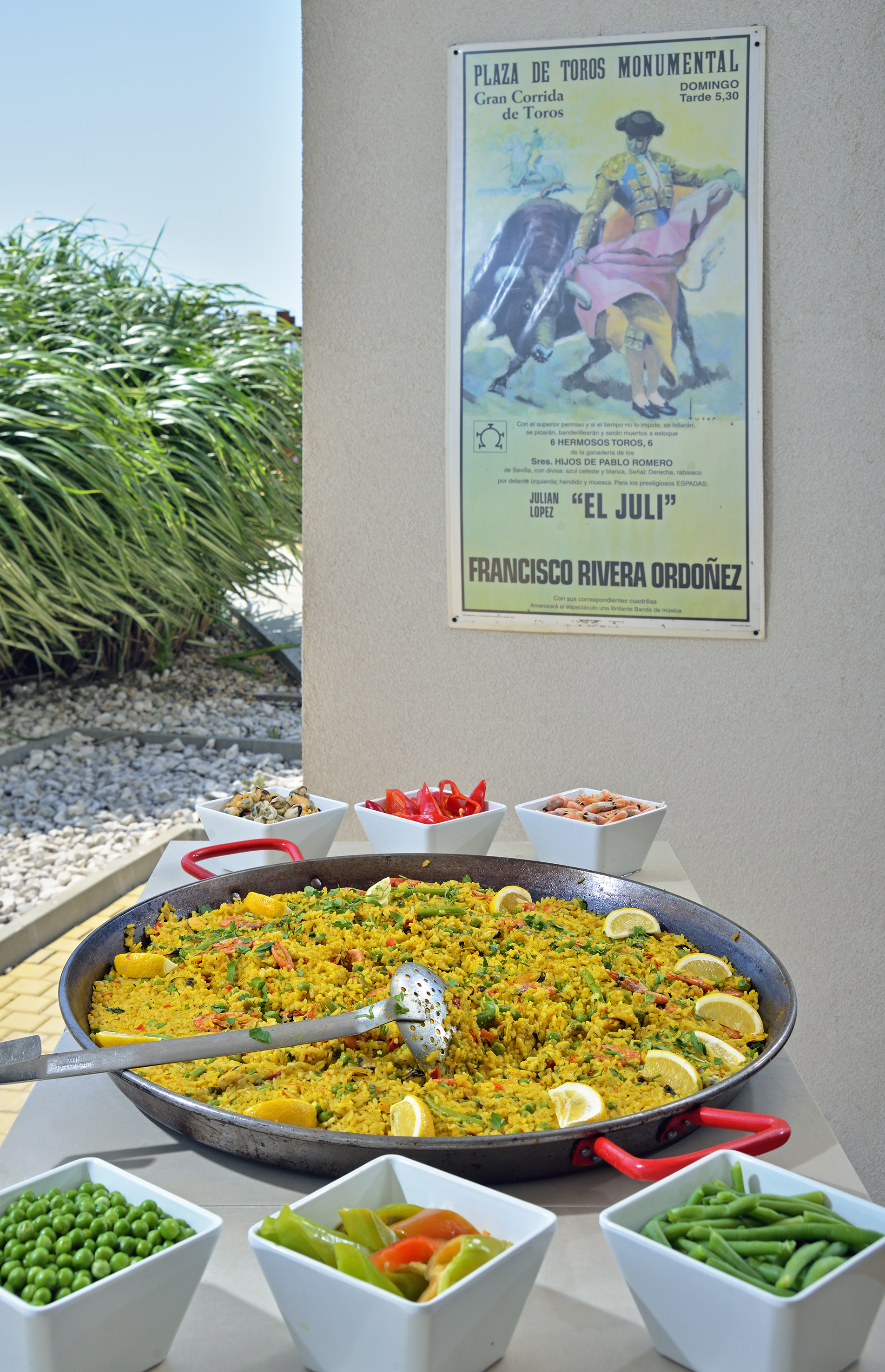 a large pan of food with a poster on the wall