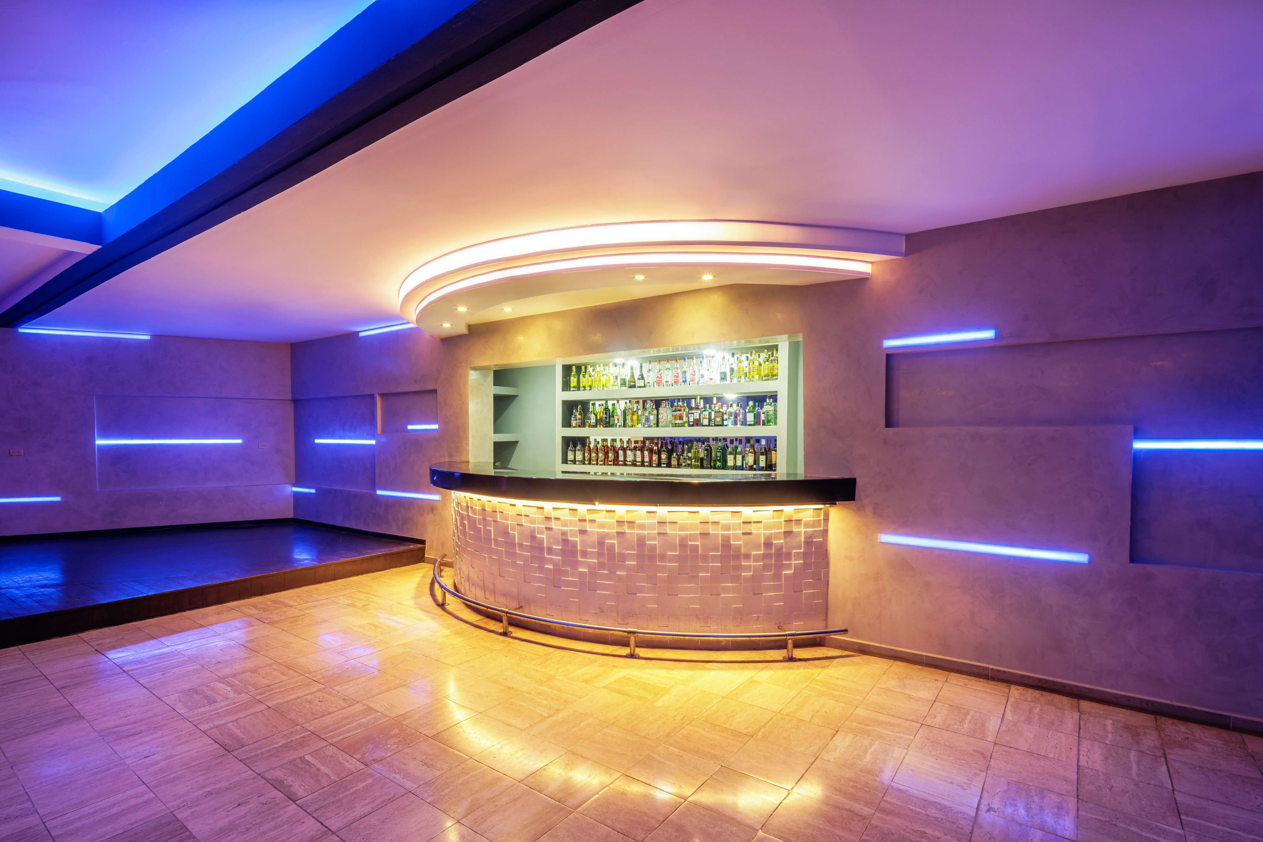 a bar with bottles on the counter