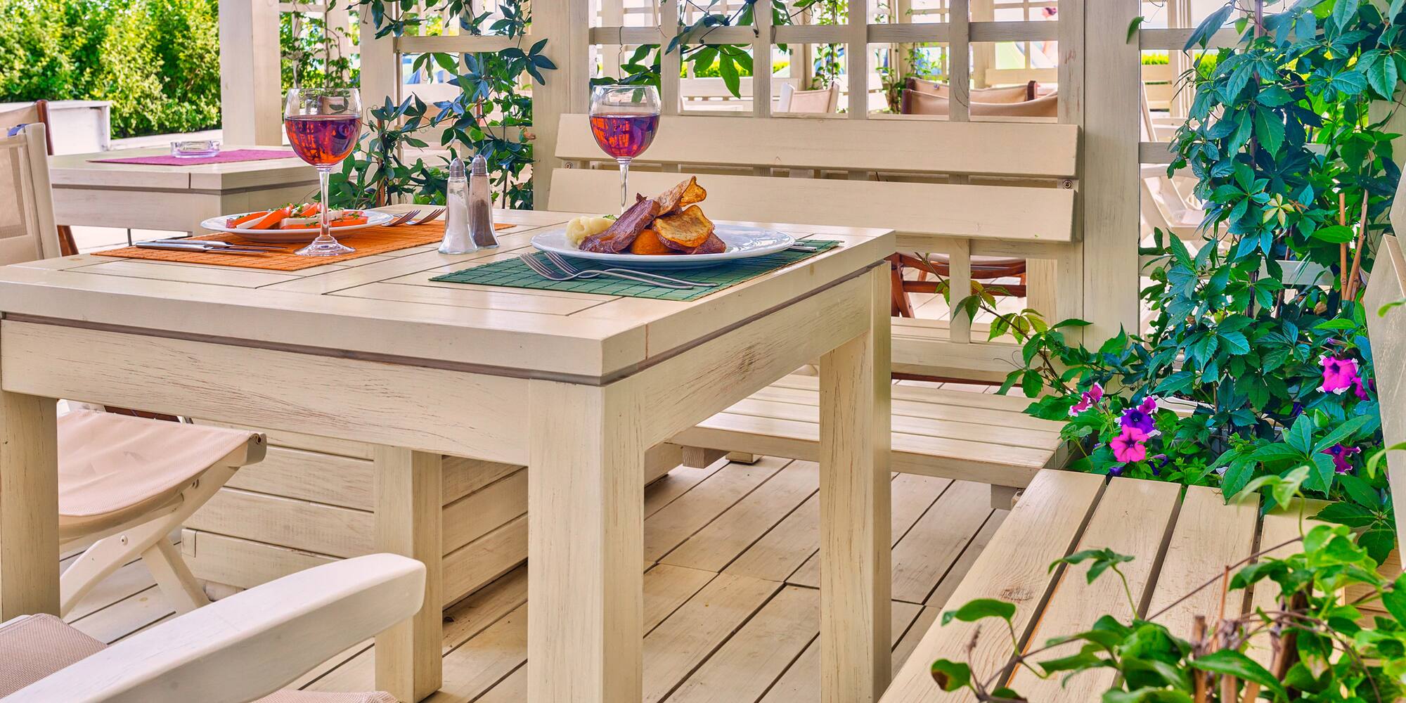 a table with food on it and a glass of wine on it