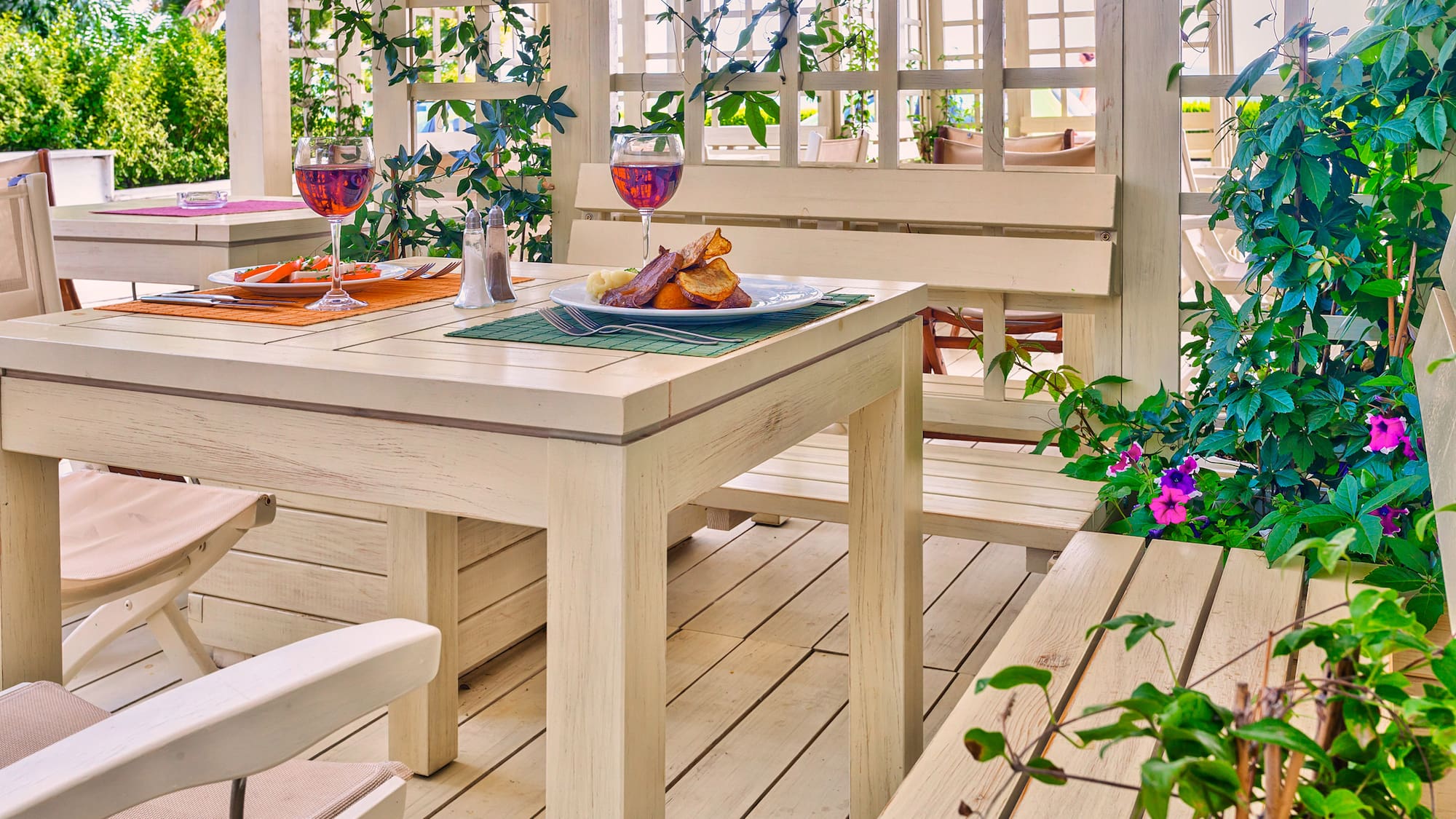 a table with food on it and a glass of wine on it