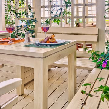 a table with food on it and a glass of wine on it