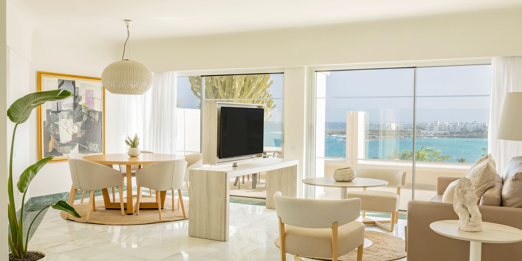 a living room with a television and a table