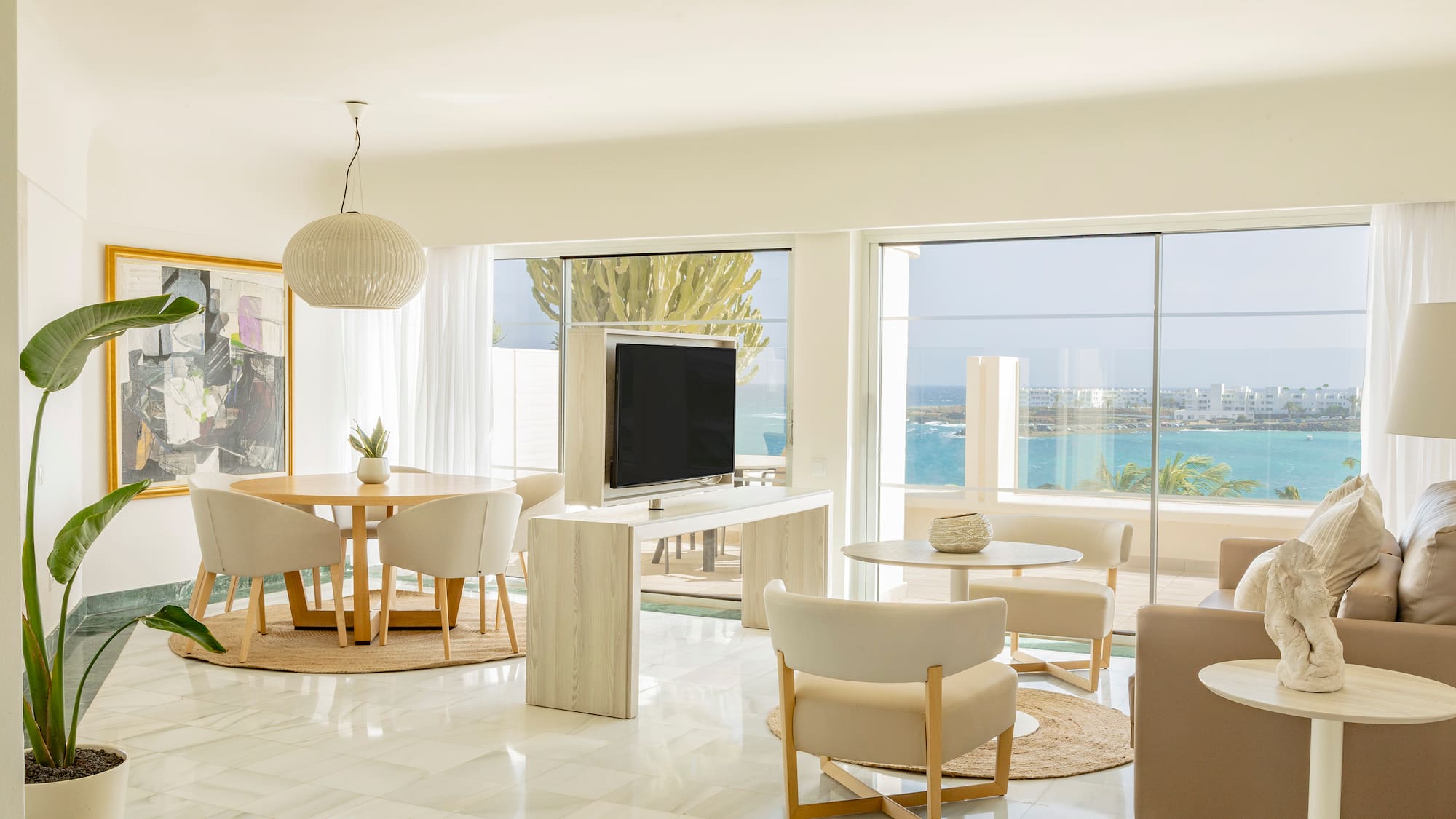 a living room with a television and a table