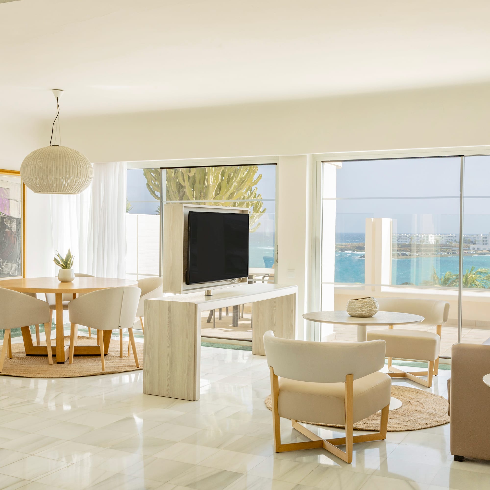 a living room with a television and a table