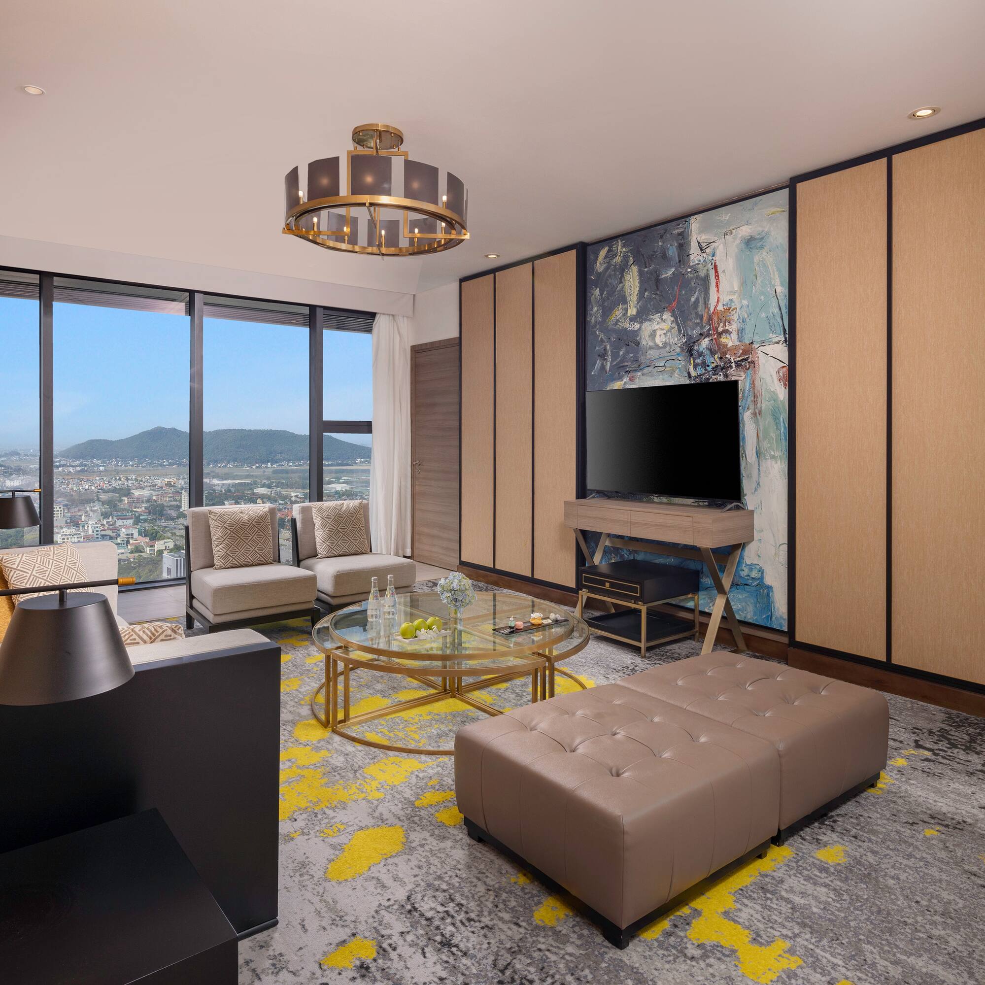 a living room with a television and a large window