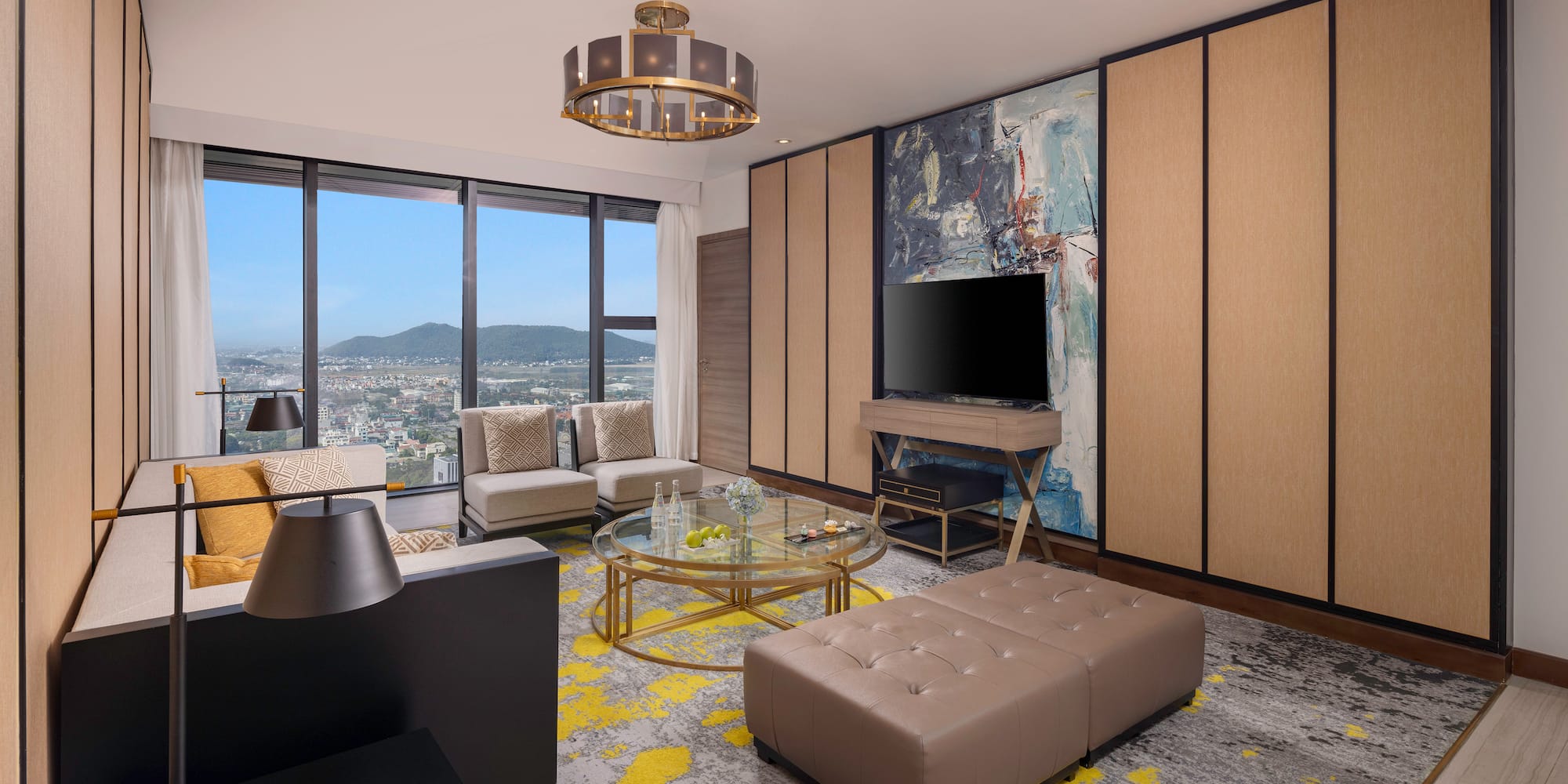 a living room with a television and a large window