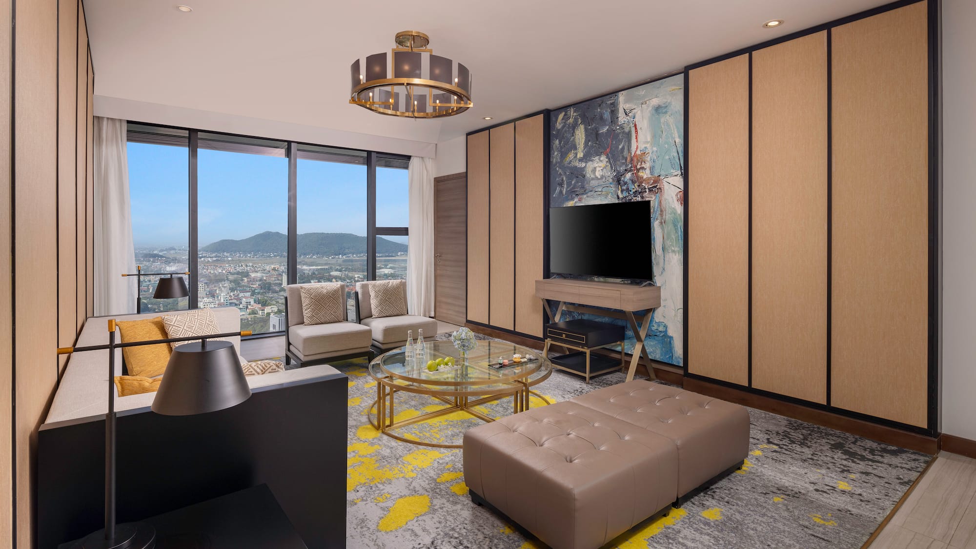 a living room with a television and a large window