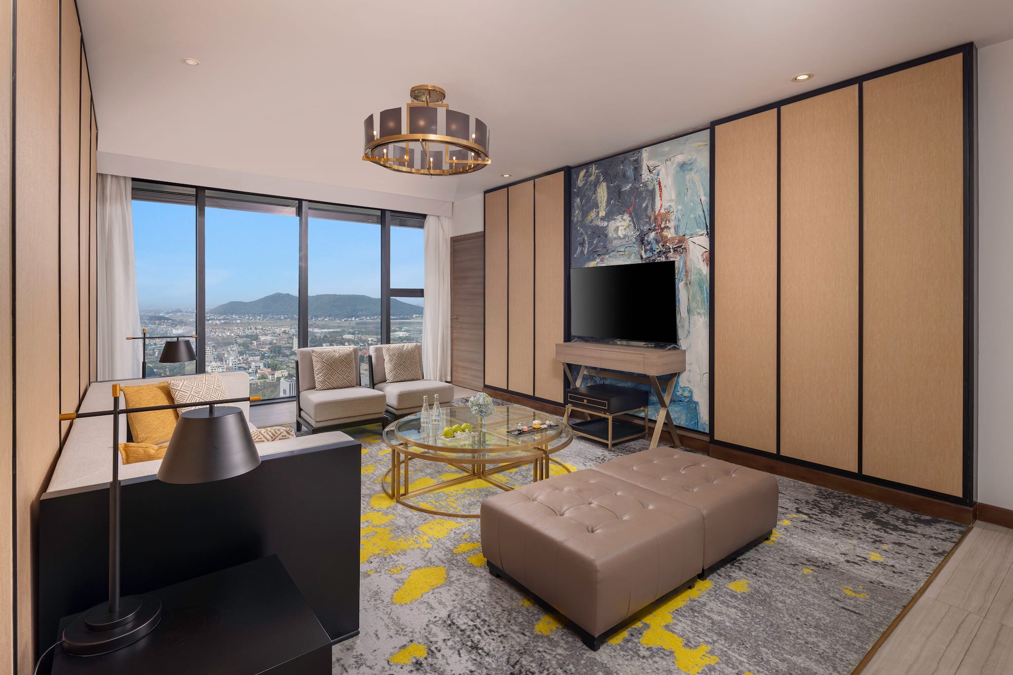 a living room with a television and a large window