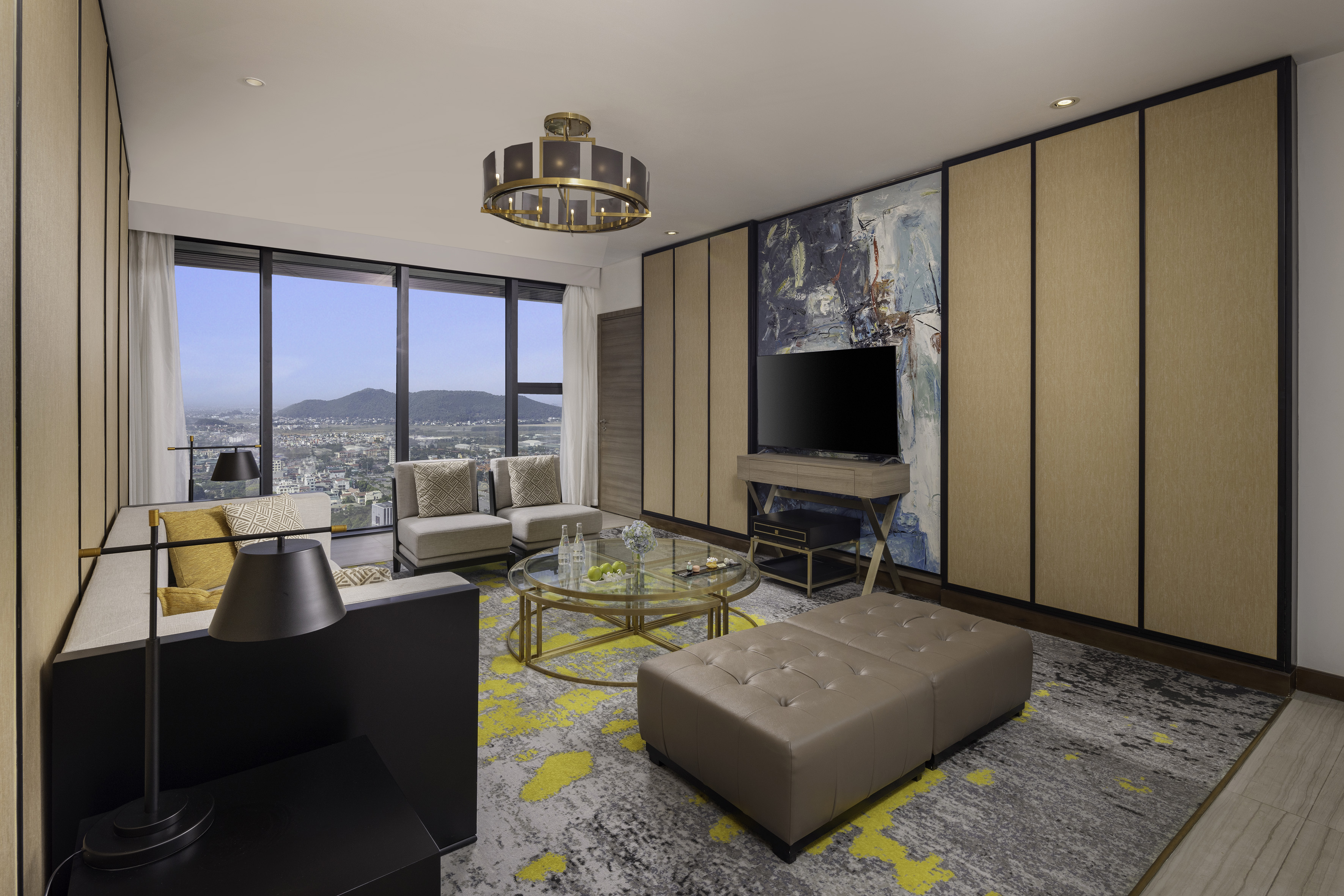 Contemporary living room suite with panoramic city views and stylish decor.