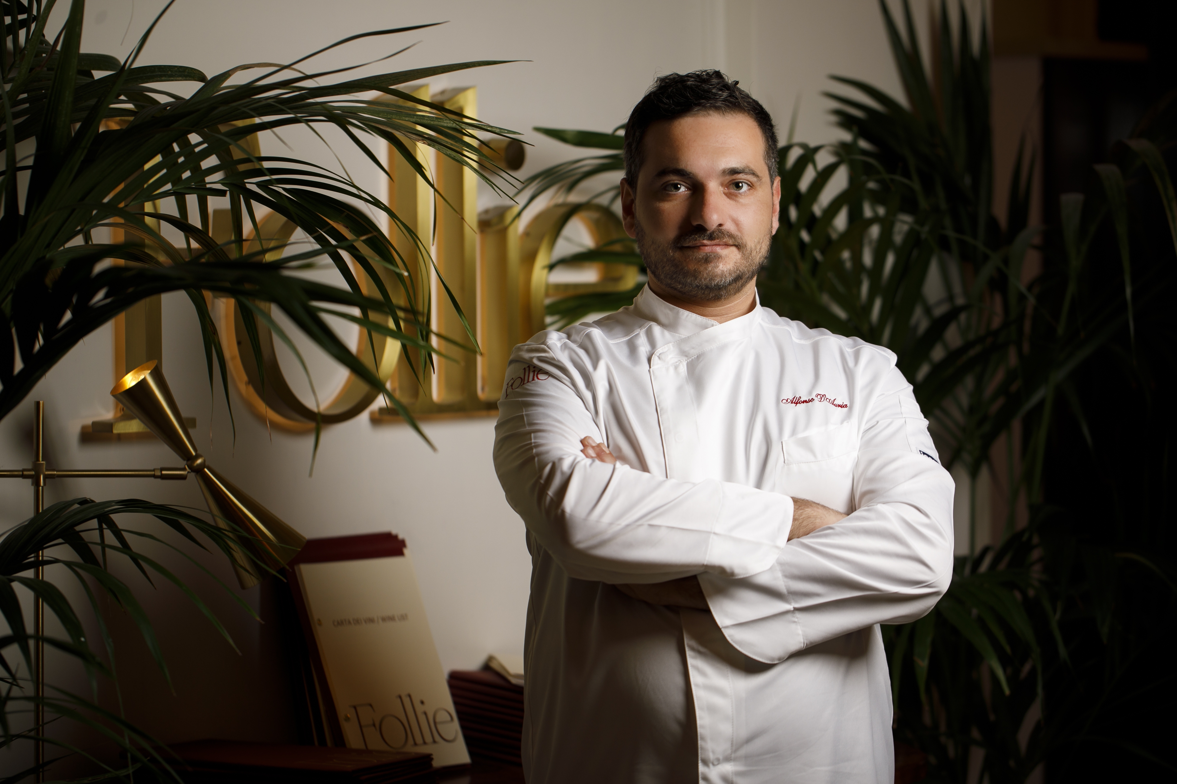 Chef Alfonso De Lucia in white jacket at Follie restaurant.