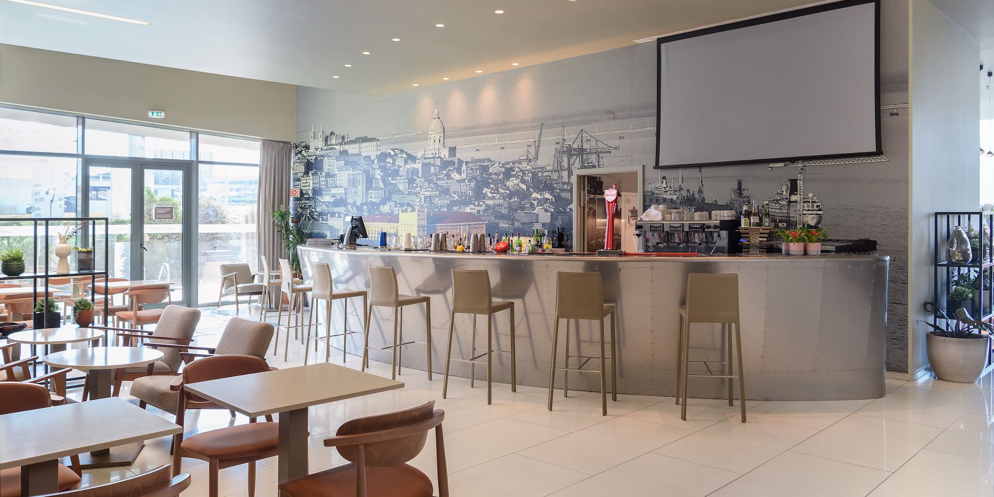 a room with a bar and chairs