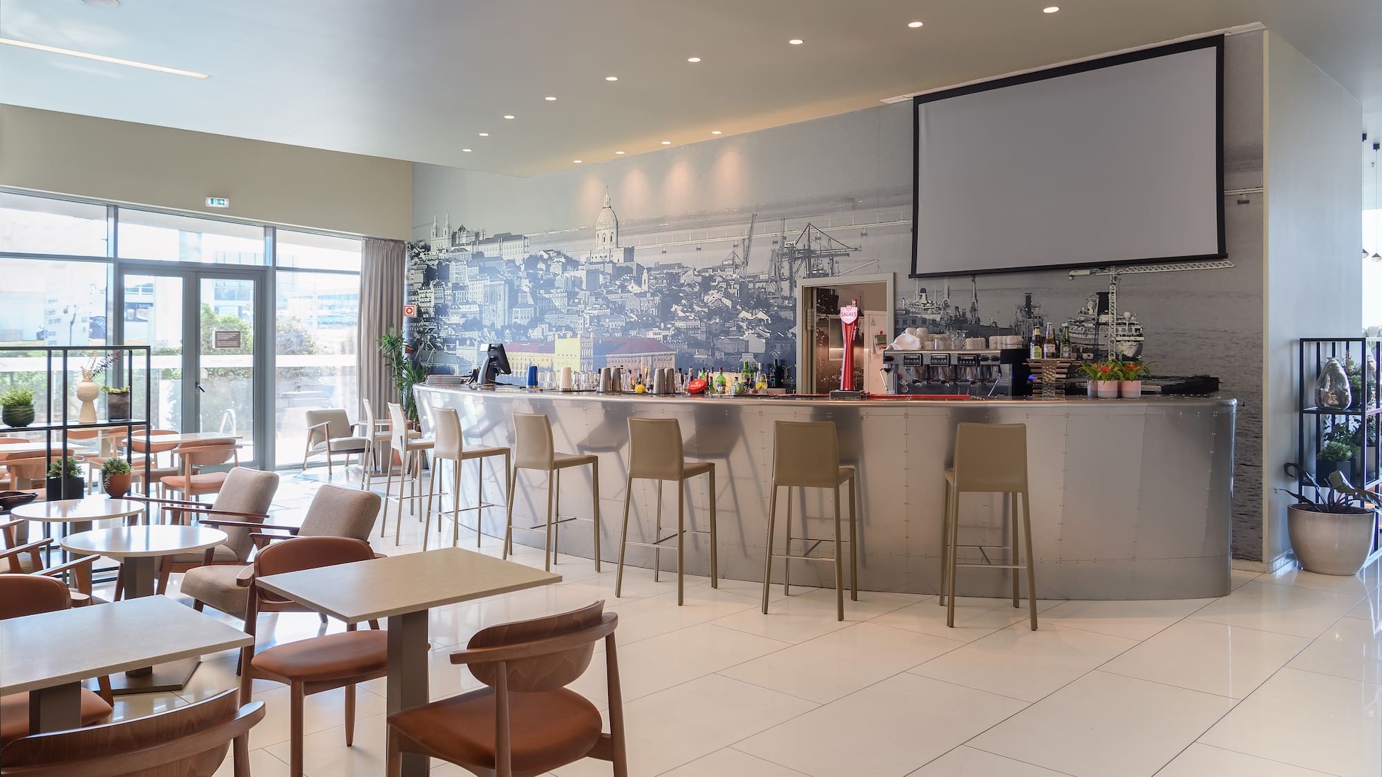 a room with a bar and chairs