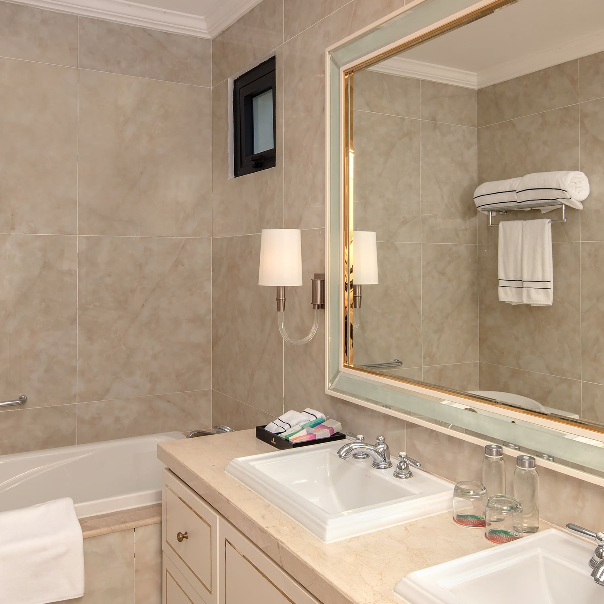 a bathroom with a mirror and sink