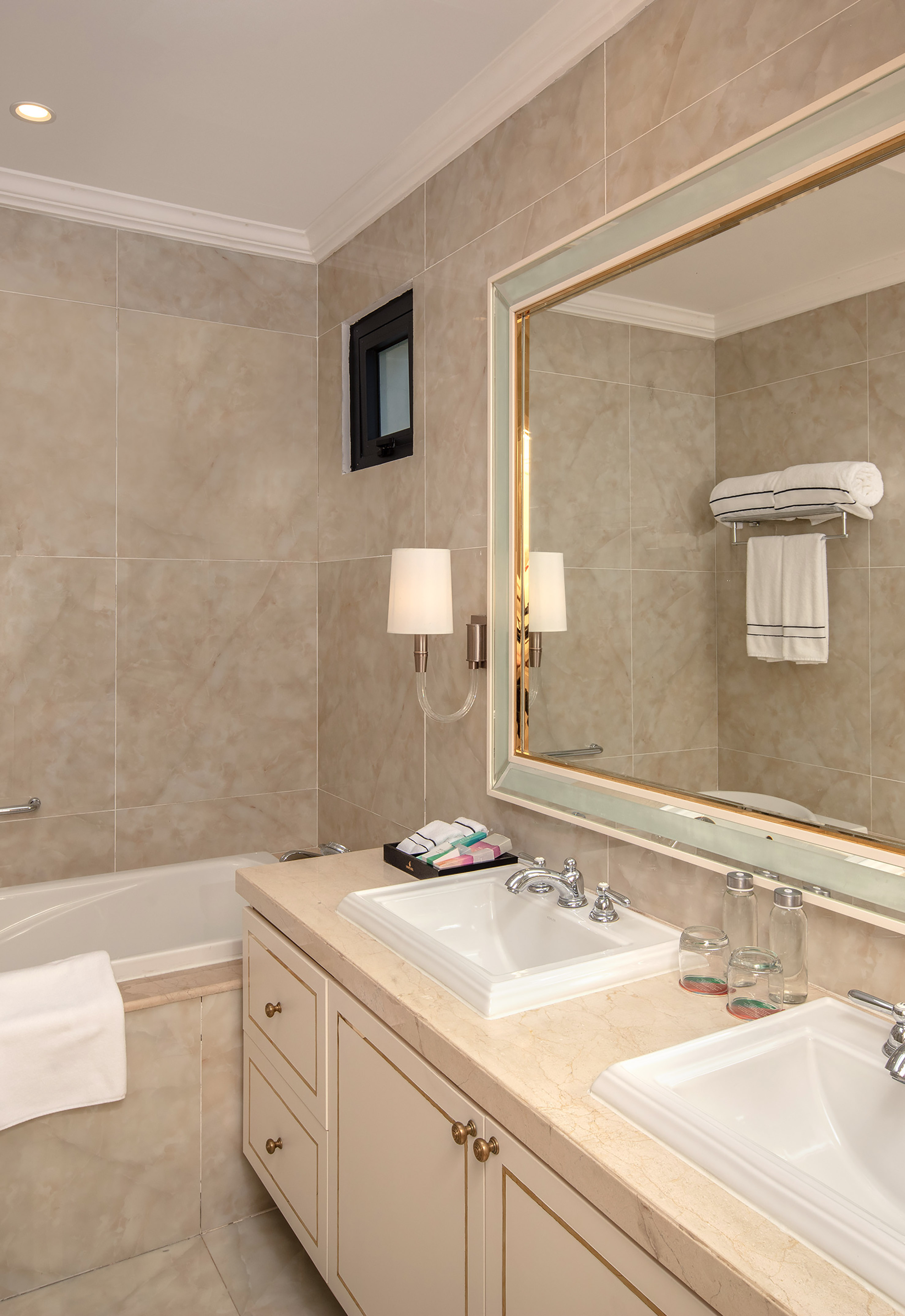 a bathroom with a mirror and sink