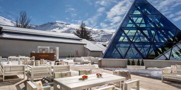 a building with a pyramid shaped glass structure