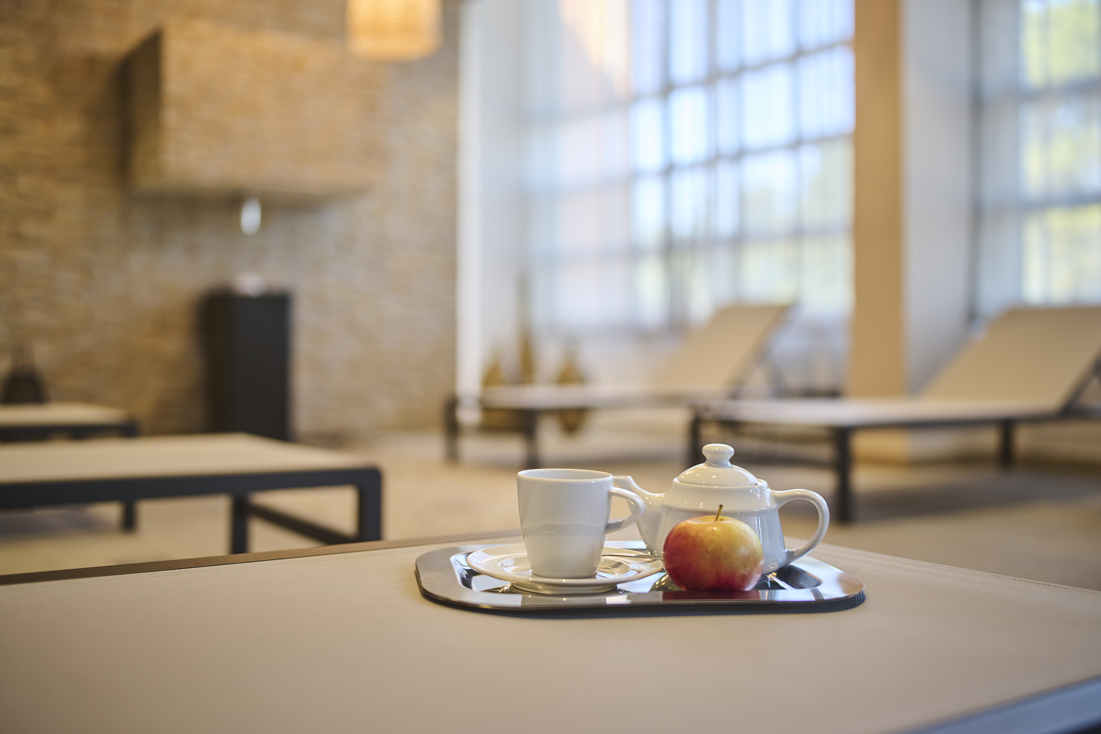 a teapot and a cup on a tray