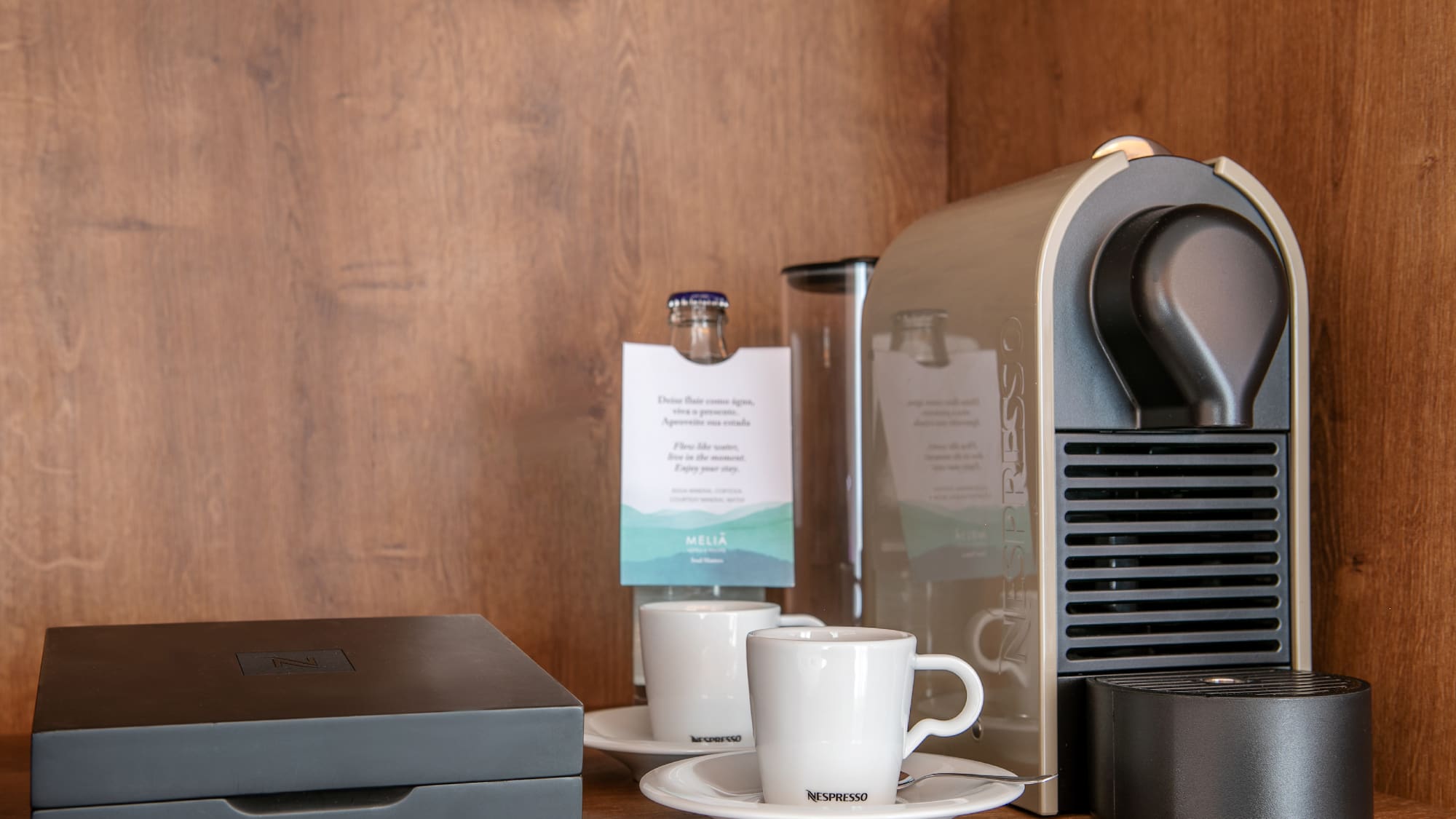 a coffee machine and coffee cups on a table