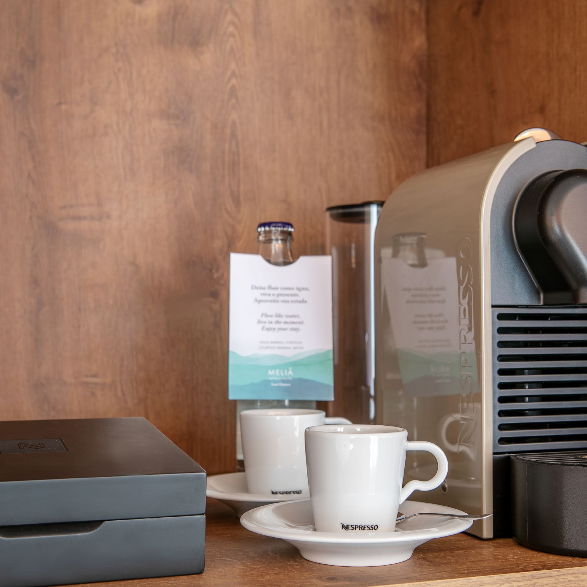 a coffee machine and coffee cups on a table