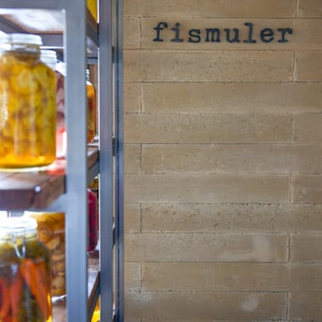 a shelf with jars of food