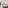 Bright hotel room with balcony, resort view, natural wood decor, and ceiling fan.