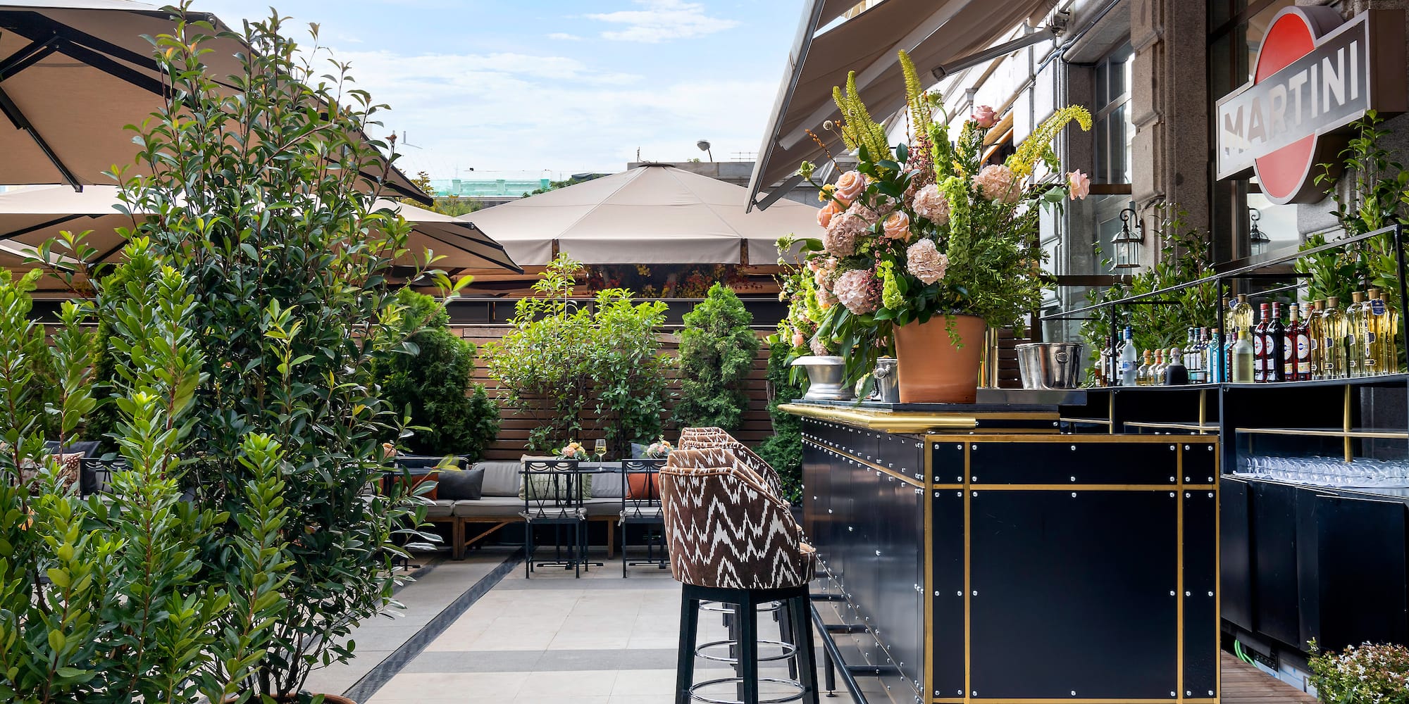 a bar with plants on the side