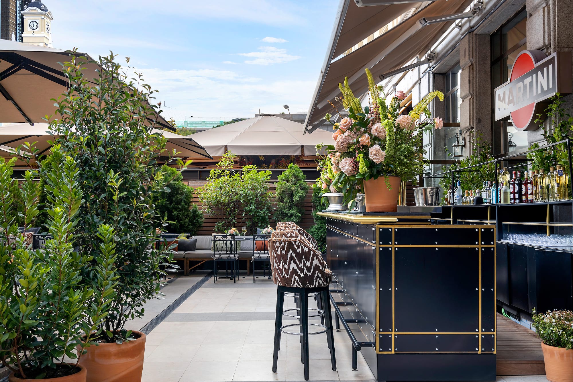 a bar with plants on the side