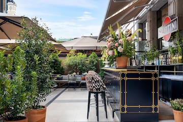 a bar with plants on the side