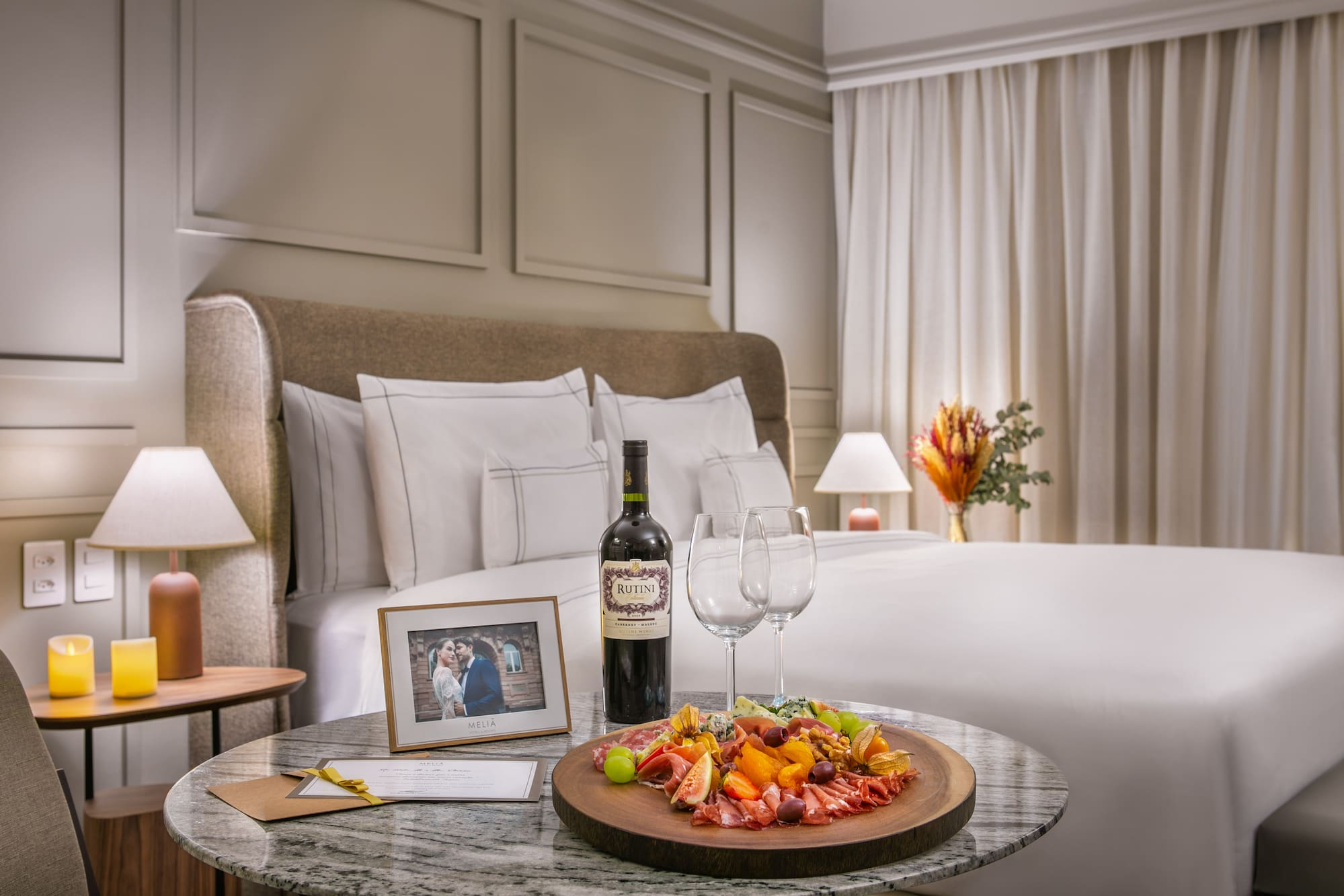 a table with food and wine on it.