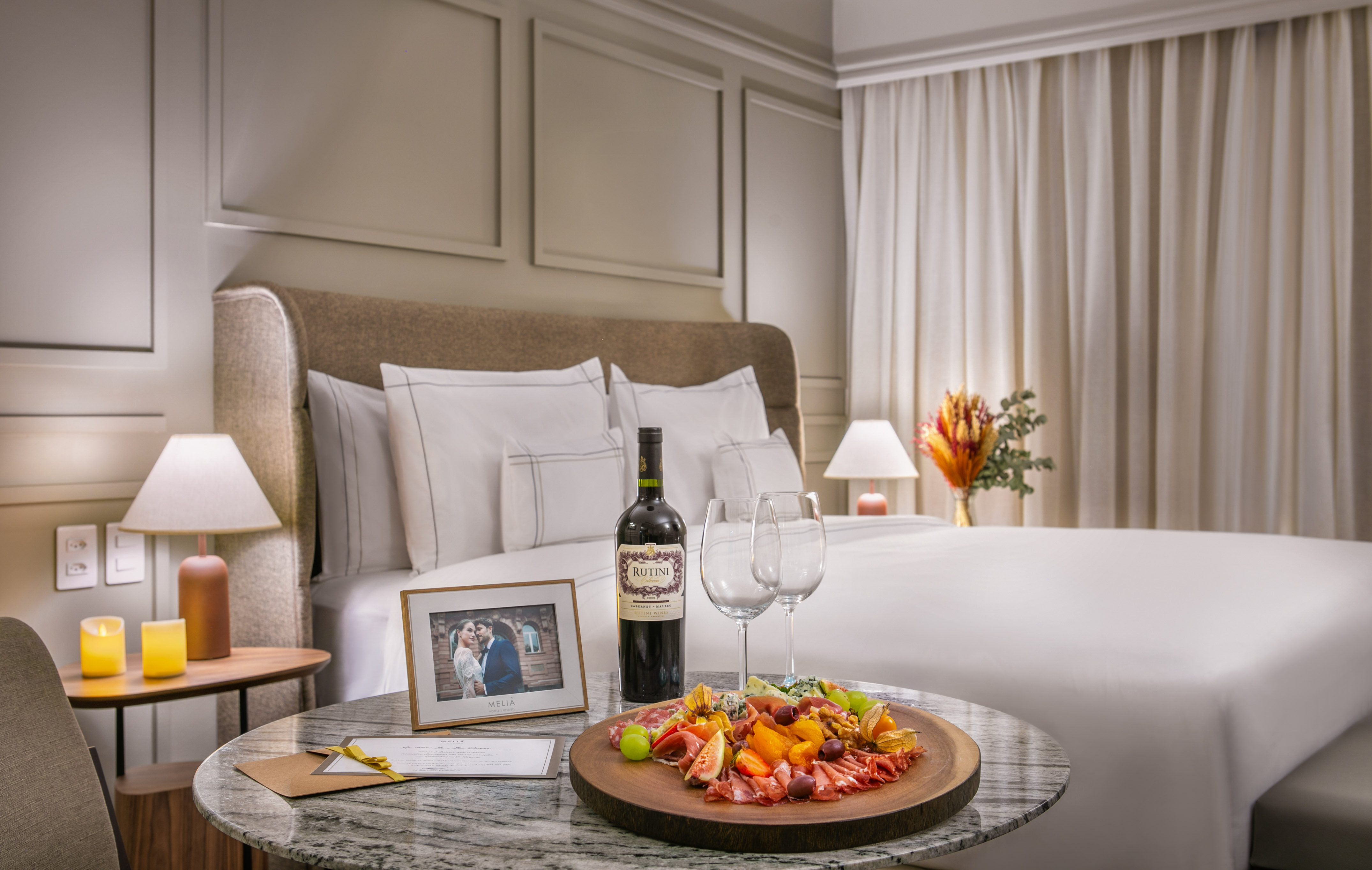 a table with food and wine on it.