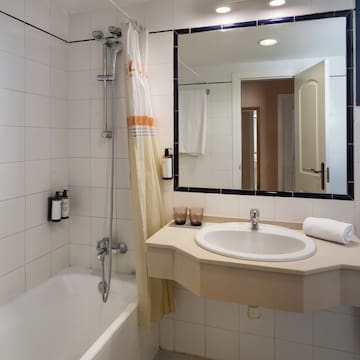 a bathroom with a sink and bathtub