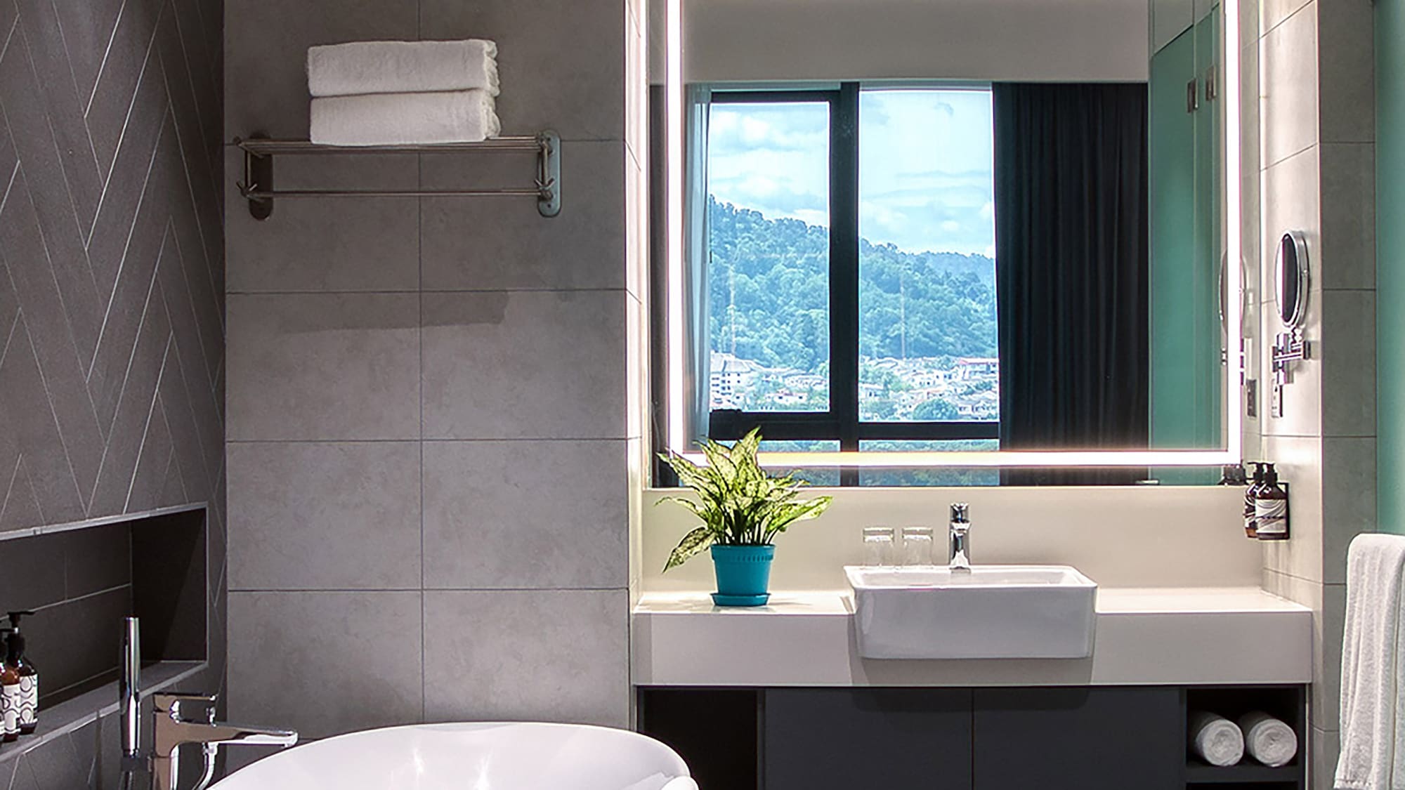 a bathroom with a tub and sink