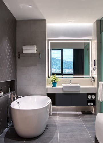 a bathroom with a tub and sink