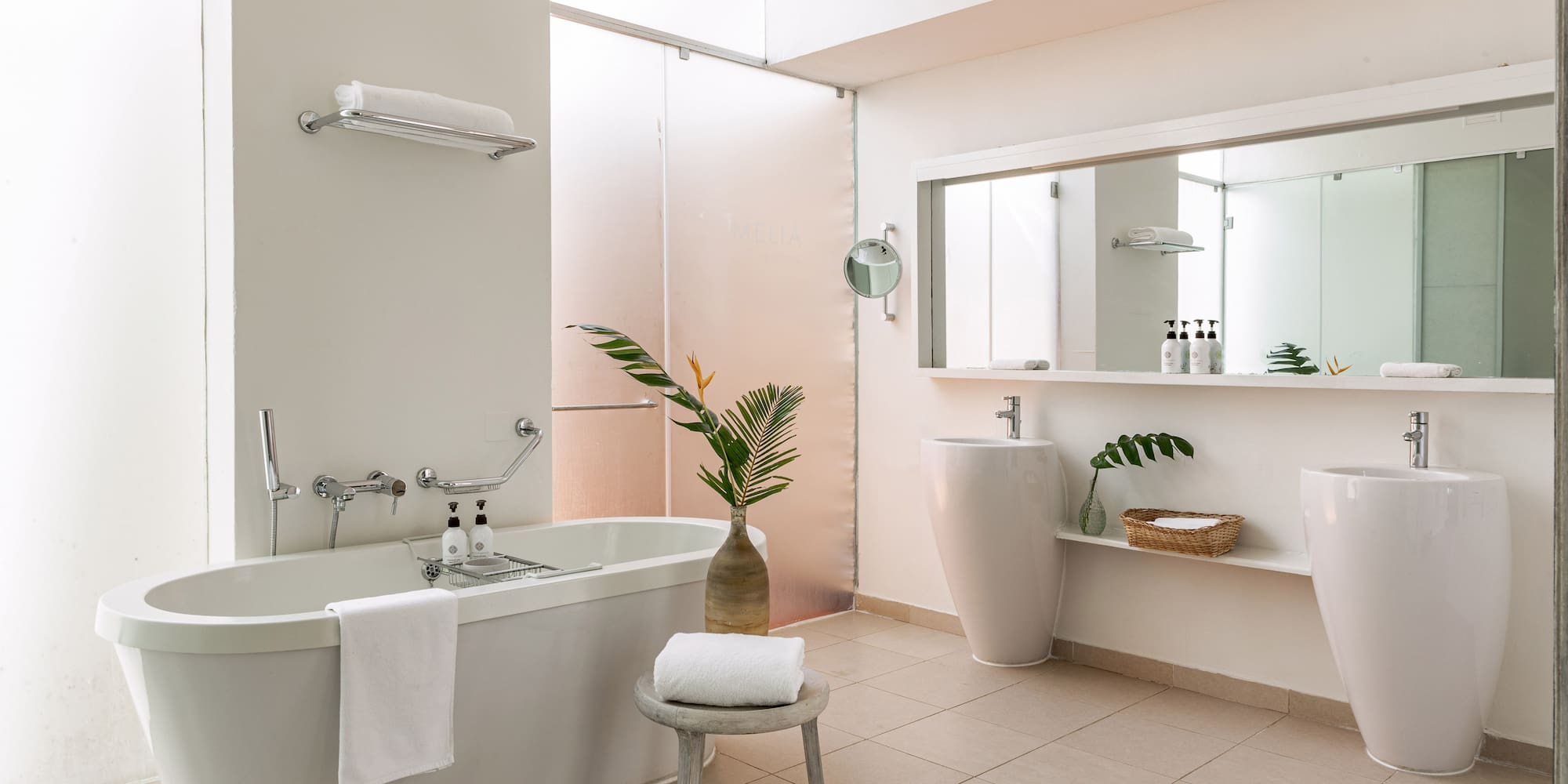 a bathroom with a tub and sink