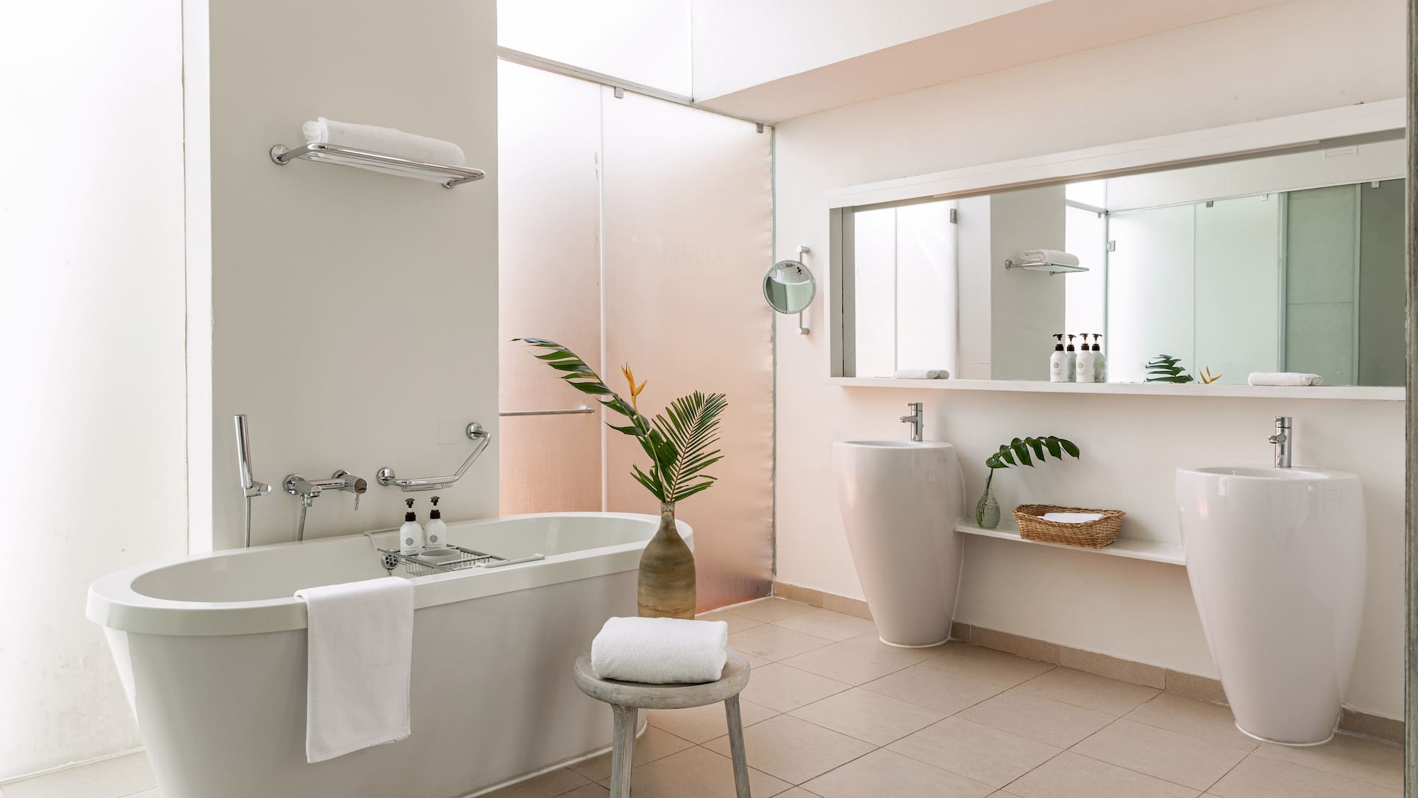 a bathroom with a tub and sink
