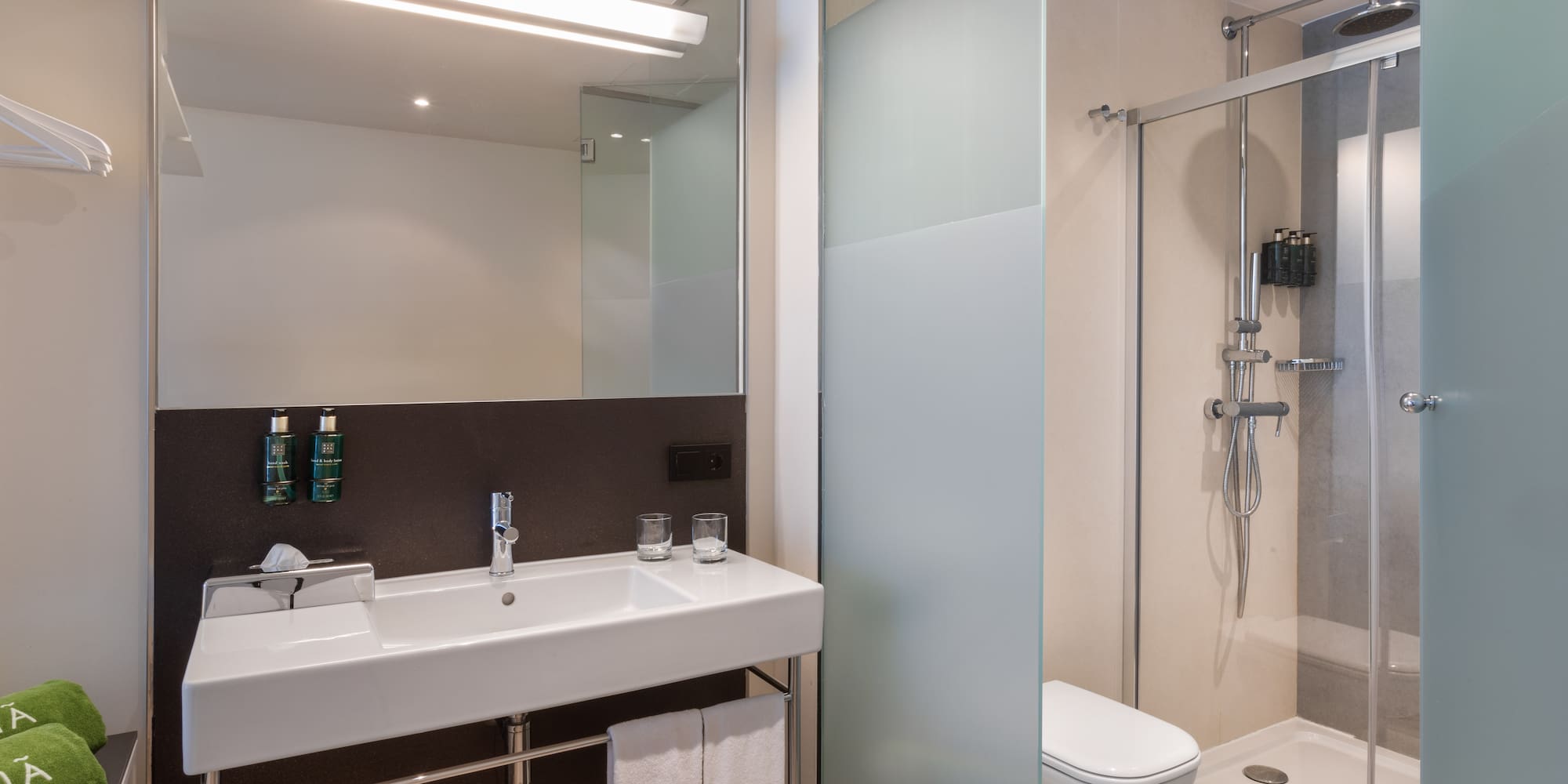 a bathroom with a shower and sink