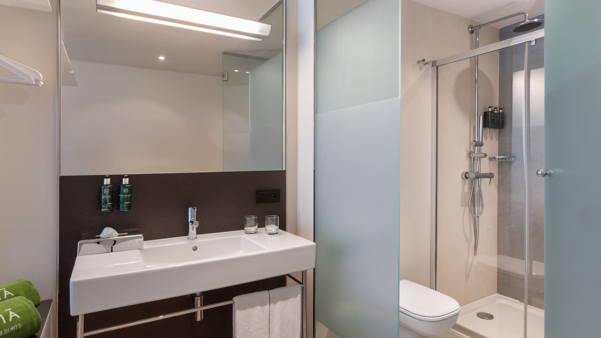 a bathroom with a shower and sink