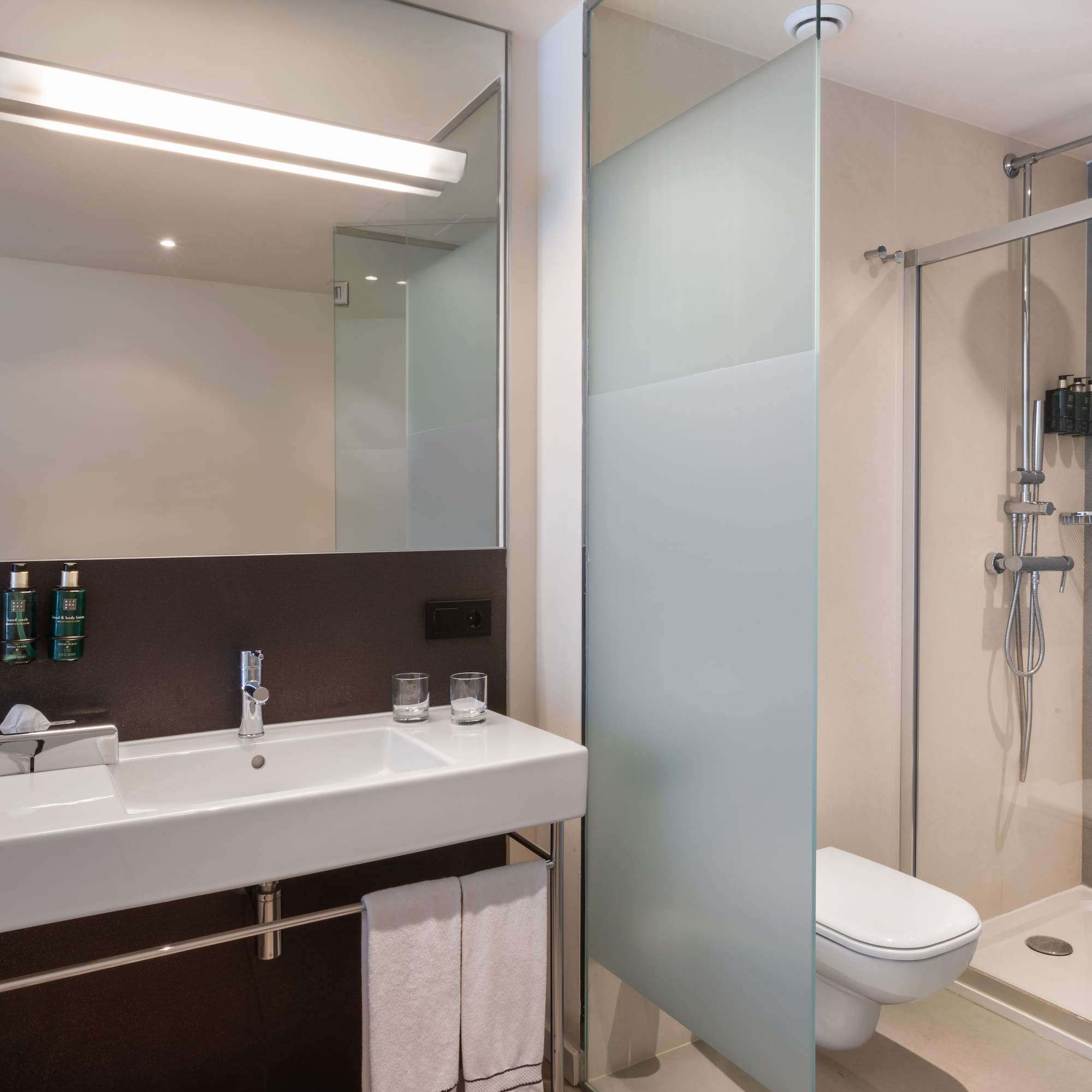 a bathroom with a shower and sink