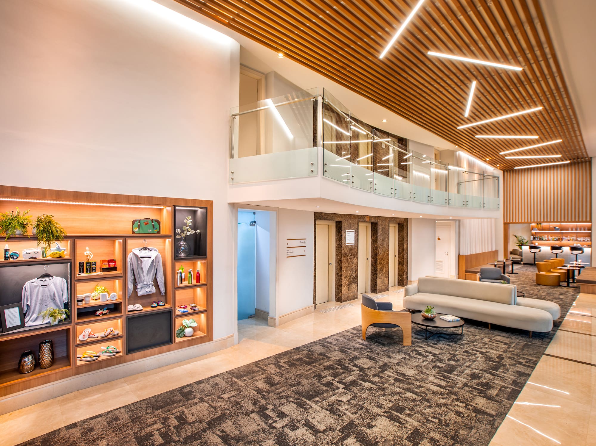 a room with a glass ceiling and a couch and a shelf