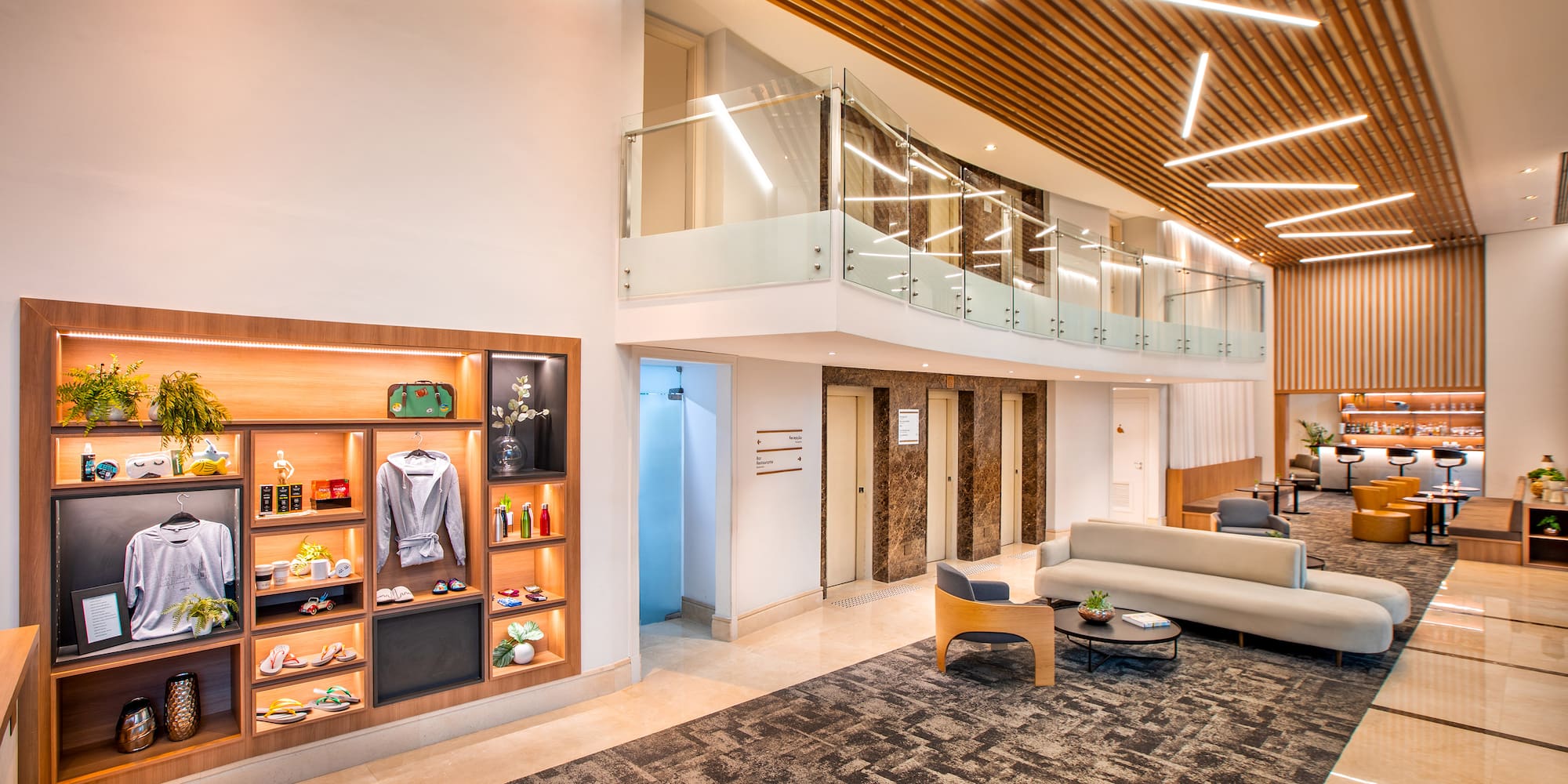 a room with a glass ceiling and a couch and a shelf