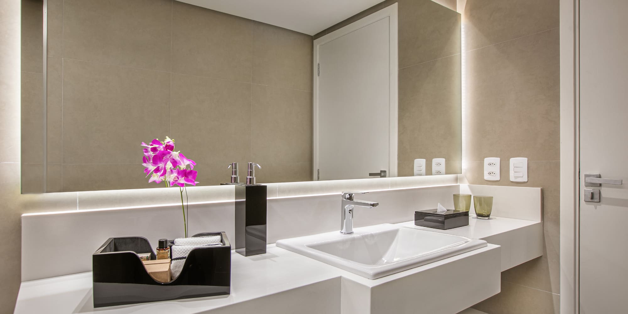 a bathroom with a sink and a mirror