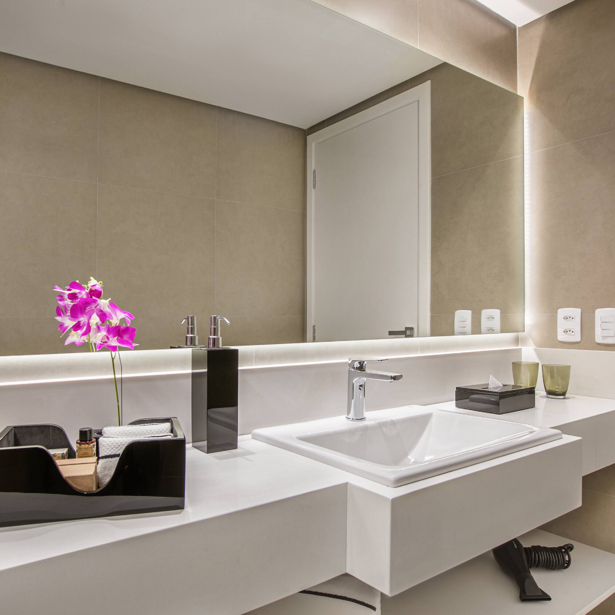 a bathroom with a sink and a mirror