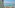 Resort balcony with ocean view, chairs, cocktail, hat, and distant islands.